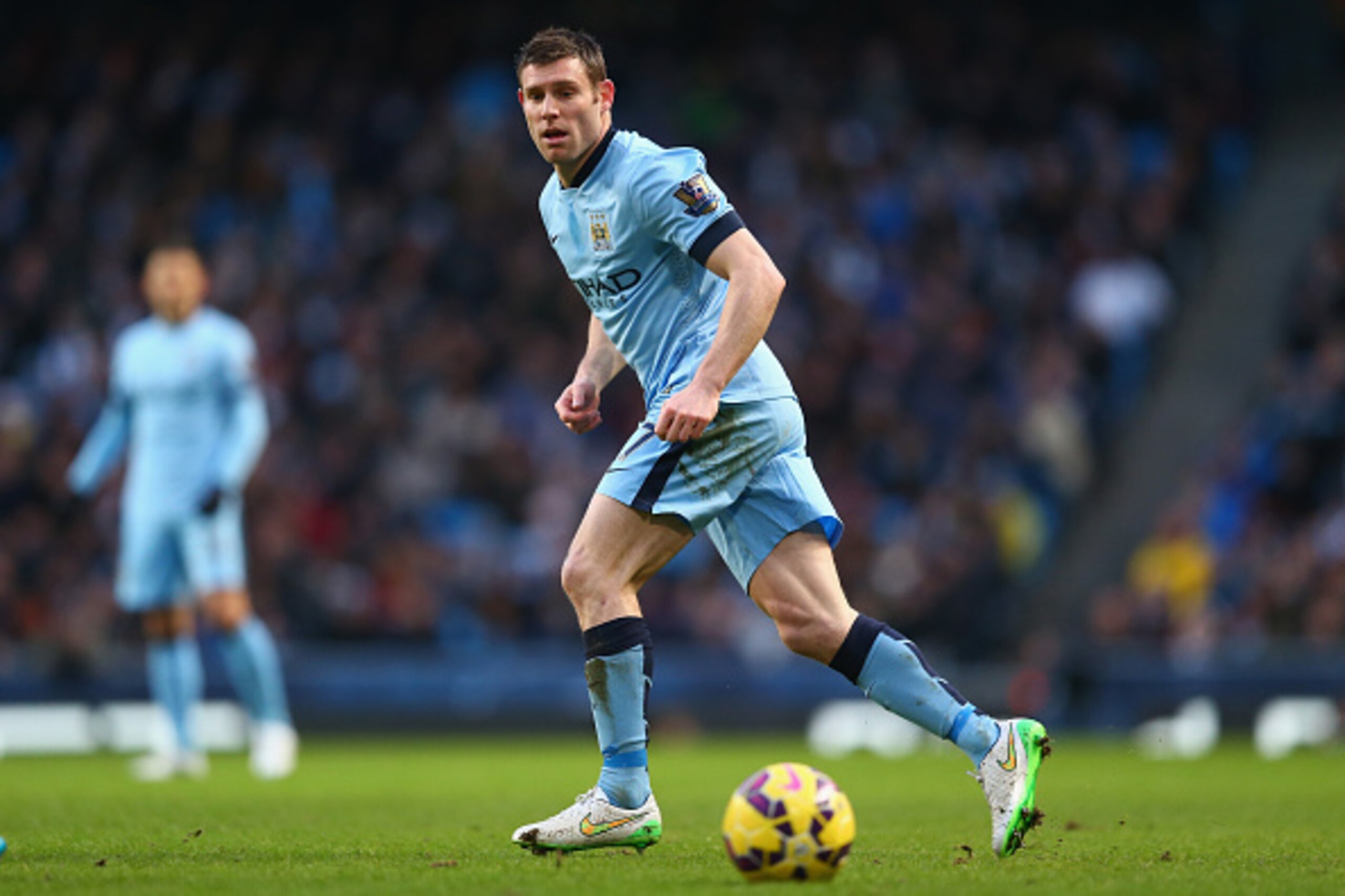 MANCHESTER, ENGLAND - JANUARY 18:  James Milner of Manchester City during the Barclays Premier League match between Manchester City and Arsenal at the Etihad Stadium on January 18, 2015 in Manchester, England.  (Photo by Michael Steele/Getty Images)