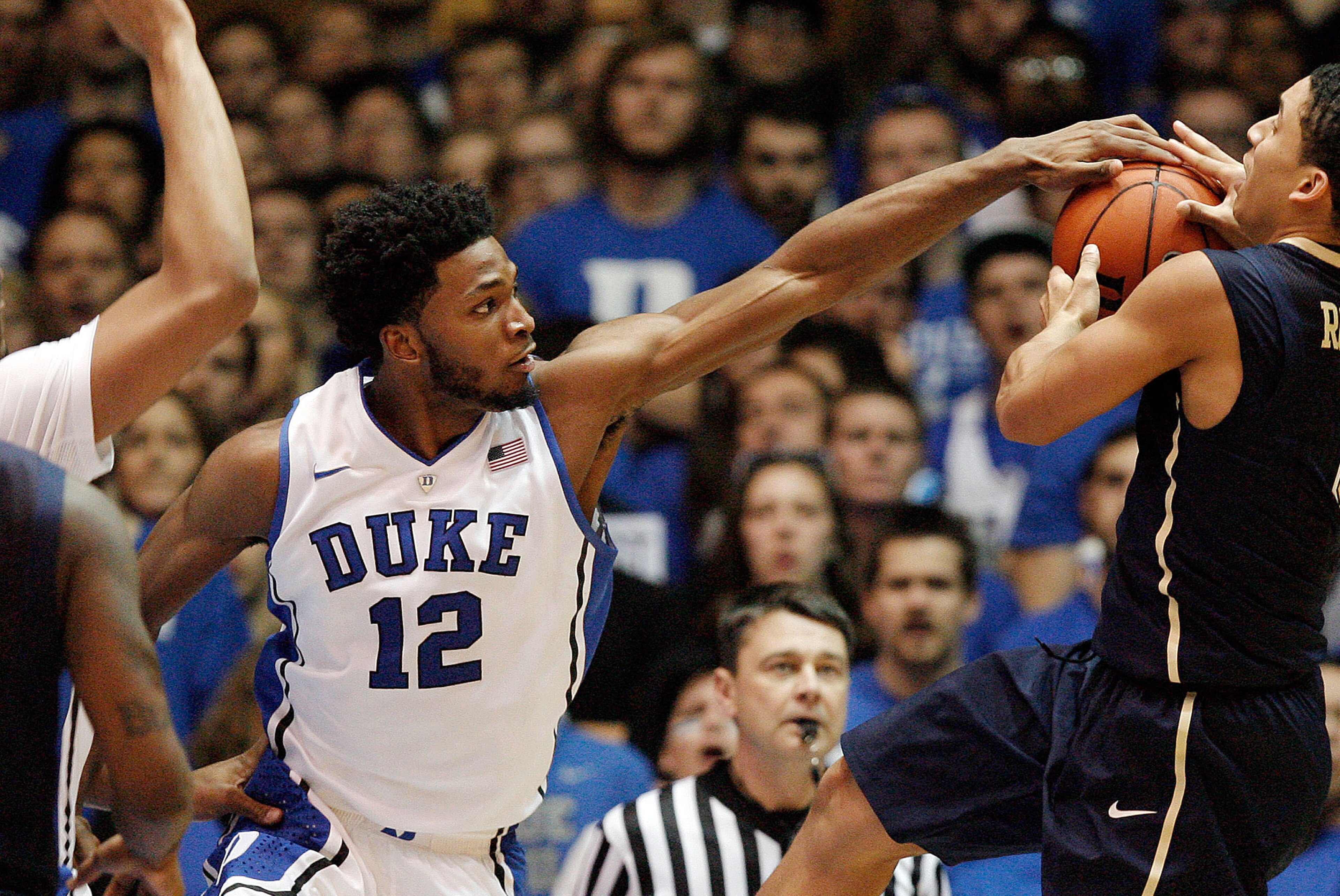 Jan 19, 2015; Durham, NC, USA; Duke Blue Devils forward Justise Winslow (12) gets his hand on the ball as Pittsburgh Panthers guard James Robinson (0) tries to shoot in their game at Cameron Indoor Stadium. Mandatory Credit: Mark Dolejs-USA TODAY Sports Jan 19, 2015; Durham, NC, USA; Duke Blue Devils forward Justise Winslow (12) gets his hand on the ball as Pittsburgh Panthers guard James Robinson (0) tries to shoot in their game at Cameron Indoor Stadium. Mandatory Credit: Mark Dolejs-USA TODAY Sports