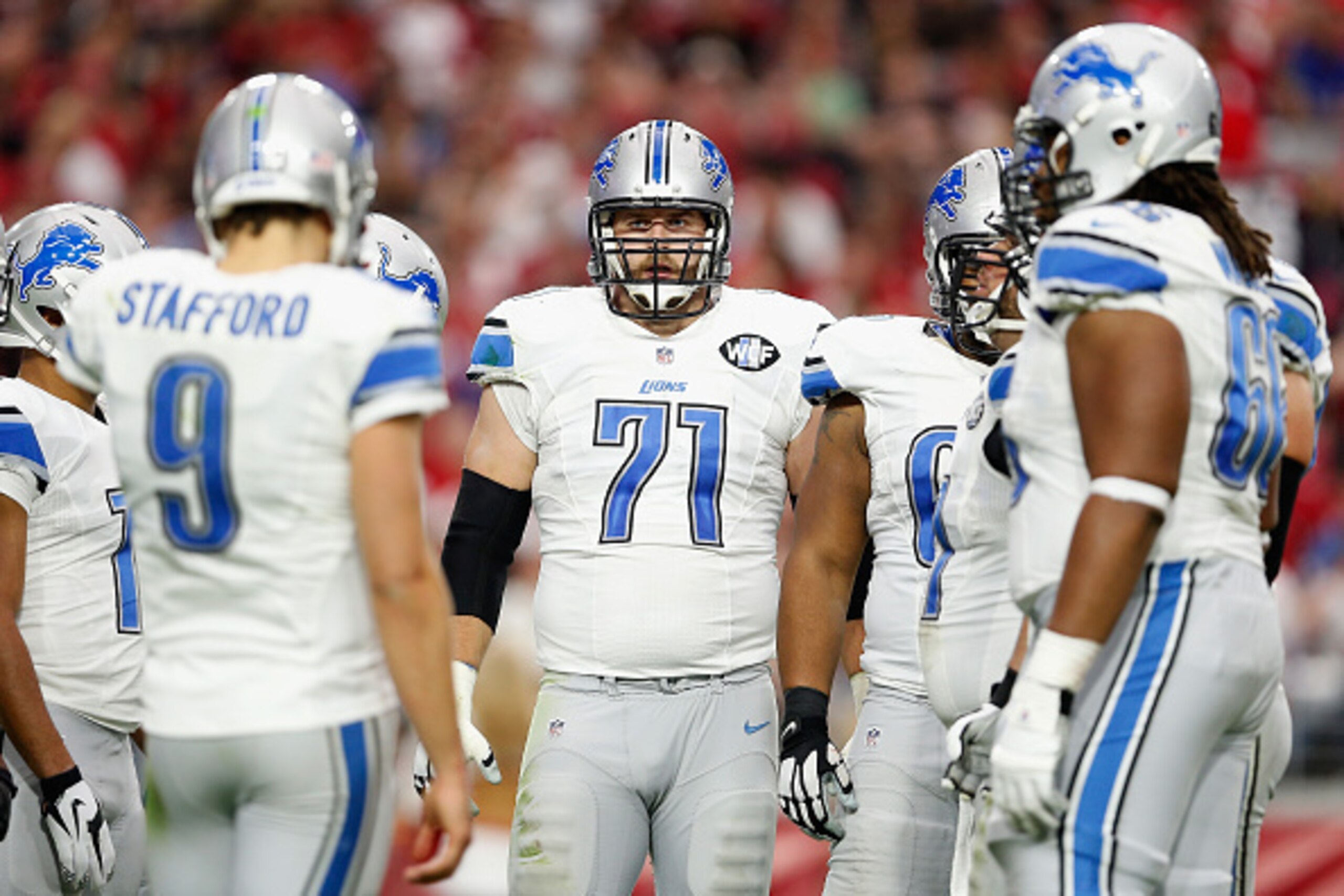 GLENDALE, AZ - NOVEMBER 16: Tackle Riley Reiff #71 of the Detroit Lions in the huddle during the NFL game against the Arizona Cardinals at the University of Phoenix Stadium on November 16, 2014 in Glendale, Arizona. The Cardinals defeated the Lions 14-6. GLENDALE, AZ - NOVEMBER 16: Tackle Riley Reiff #71 of the Detroit Lions in the huddle during the NFL game against the Arizona Cardinals at the University of Phoenix Stadium on November 16, 2014 in Glendale, Arizona. The Cardinals defeated the Lions 14-6.