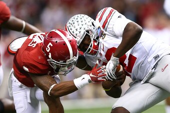 NEW ORLEANS, LA - JANUARY 01:  Cardale Jones #12 of the Ohio State Buckeyes in action against the Alabama Crimson Tide during the All State Sugar Bowl at the Mercedes-Benz Superdome on January 1, 2015 in New Orleans, Louisiana.  (Photo by Streeter Lecka/G