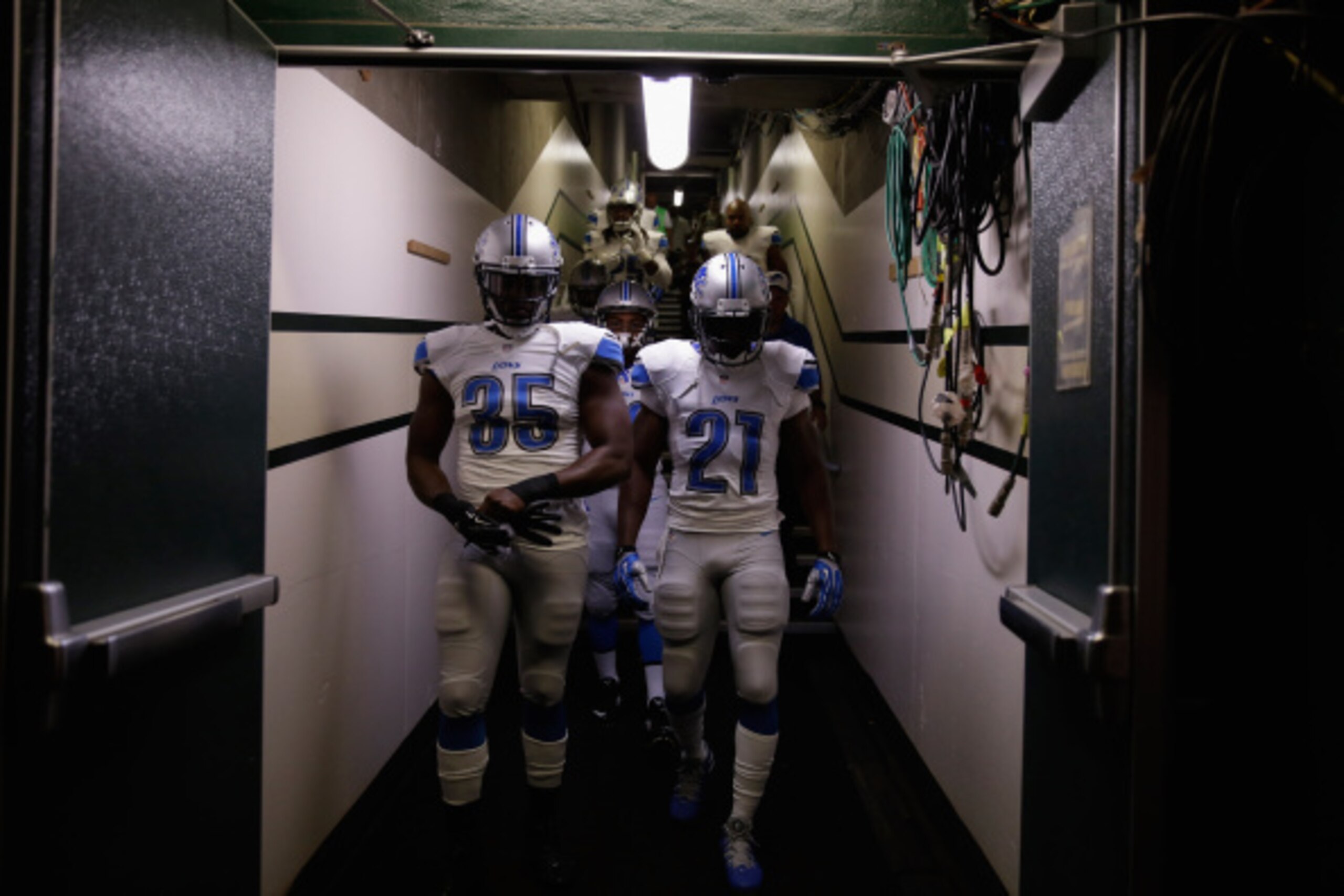 OAKLAND, CA - AUGUST 15: Joique Bell #35 and Reggie Bush #21 of the Detroit Lions walk down the tunnel for their game against the Oakland Raiders during their preseason game at O.co Coliseum on August 15, 2014 in Oakland, California. (Photo by Ezra Shaw OAKLAND, CA - AUGUST 15: Joique Bell #35 and Reggie Bush #21 of the Detroit Lions walk down the tunnel for their game against the Oakland Raiders during their preseason game at O.co Coliseum on August 15, 2014 in Oakland, California. (Photo by Ezra Shaw