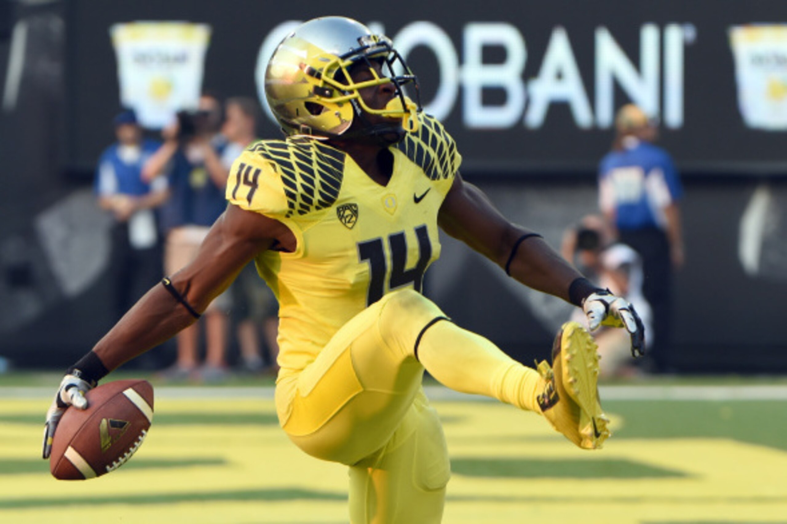 EUGENE, OR -SEPTEMBER 06: Defensive back Ifo Ekpre-Olomu #14 of the Oregon Ducks celebrates after intercepting a pass during the fourth quarter of the game against the Michigan State Spartans at Autzen Stadium on September 6, 2014 in Eugene, Oregon. Orego