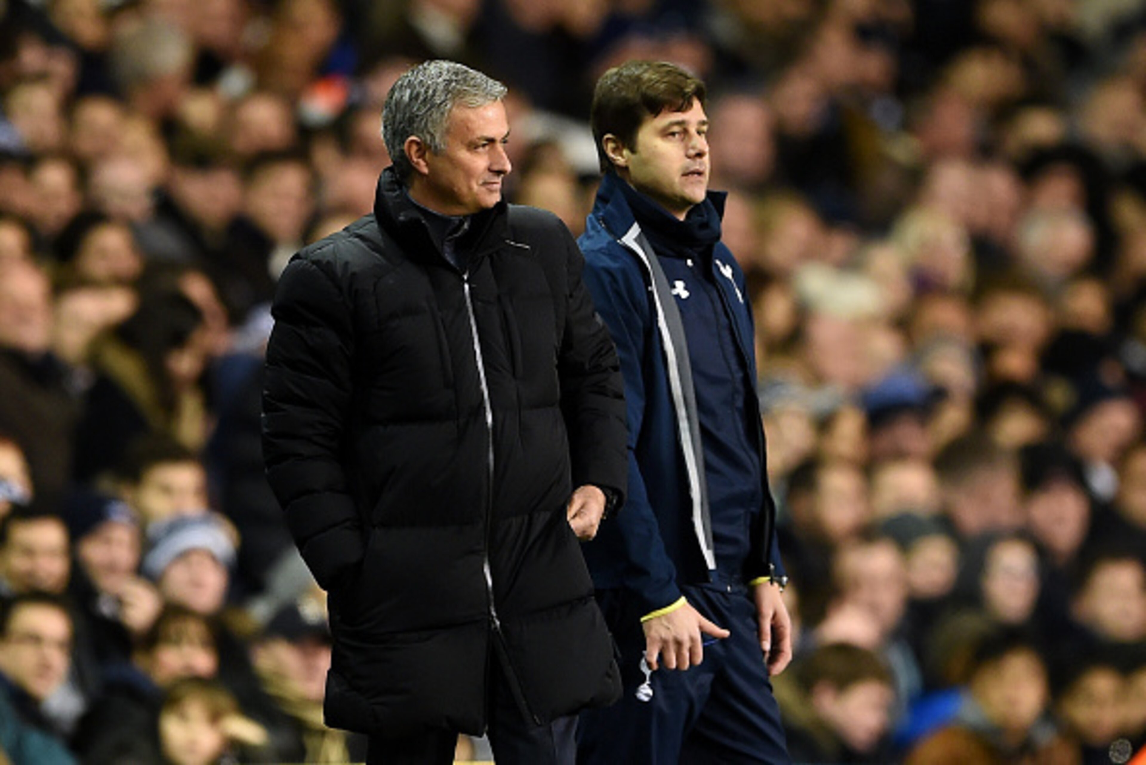 LONDON, ENGLAND - JANUARY 01: Jose Mourinho, manager of Chelsea smiles as he stands next to Mauricio Pochettino, manager of Spurs during the Barclays Premier League match between Tottenham Hotspur and Chelsea at White Hart Lane on January 1, 2015 in Lond LONDON, ENGLAND - JANUARY 01: Jose Mourinho, manager of Chelsea smiles as he stands next to Mauricio Pochettino, manager of Spurs during the Barclays Premier League match between Tottenham Hotspur and Chelsea at White Hart Lane on January 1, 2015 in Lond