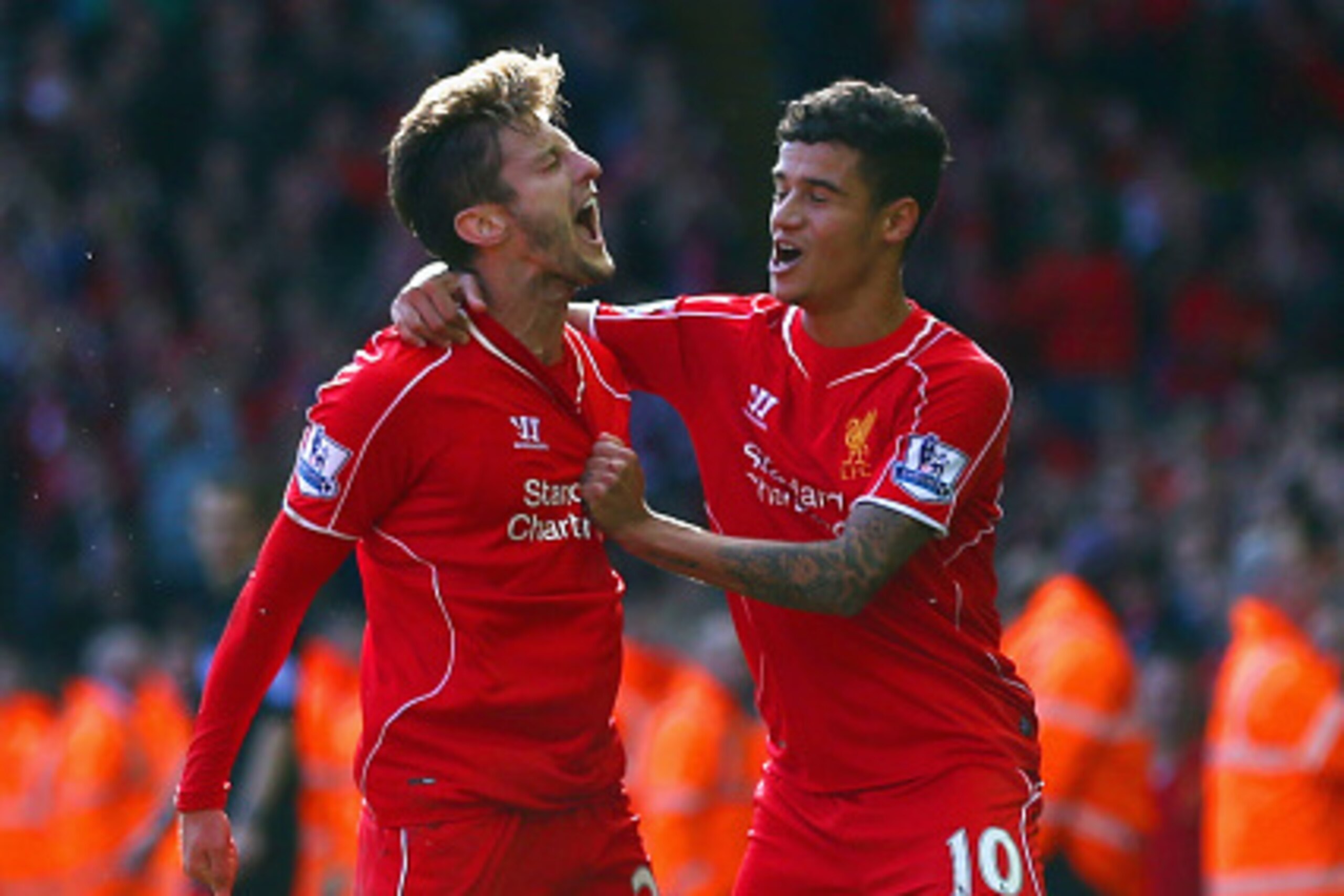 LIVERPOOL, ENGLAND - OCTOBER 04:  Adam Lallana of Liverpool is congratulated by Philippe Coutinho of Liverpool (R) on scoring the opening goal during the Barclays Premier League match between Liverpool and West Bromwich Albion at Anfield on October 4, 201