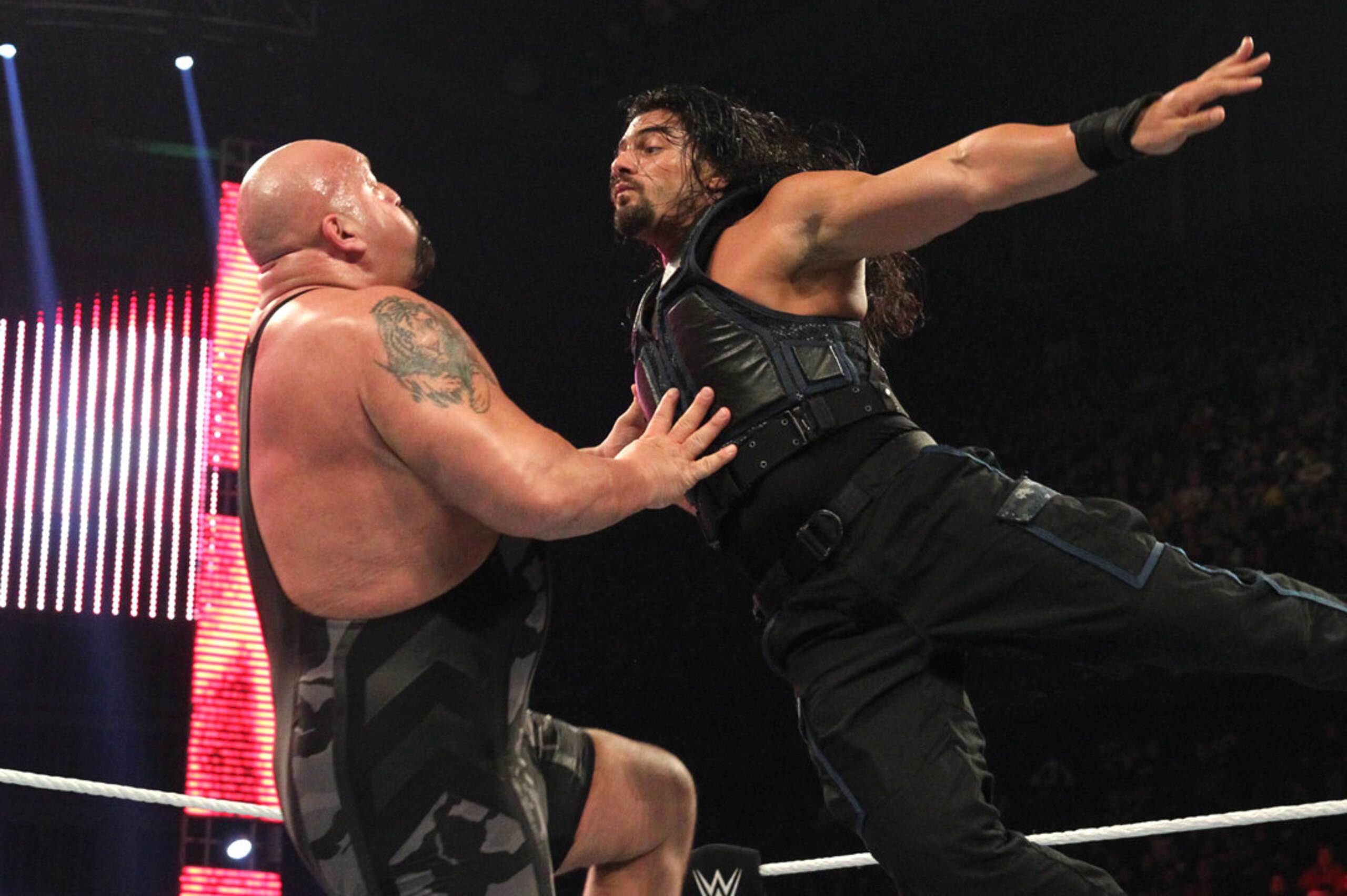 Roman Reigns flies at Big Show.