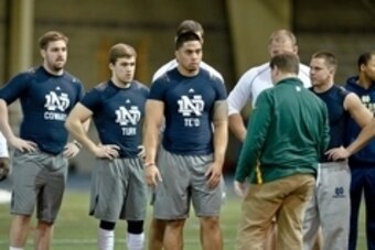 Mar 26, 2013; South Bend, IN, USA; Notre Dame Fighting Irish former players Jordan Cowart , Ben Turk , Manti Te'o and Robby Toma listen to instructions during Notre Dame pro day at the Loftus Center. Mandatory Credit: Matt Cashore-USA TODAY Sports