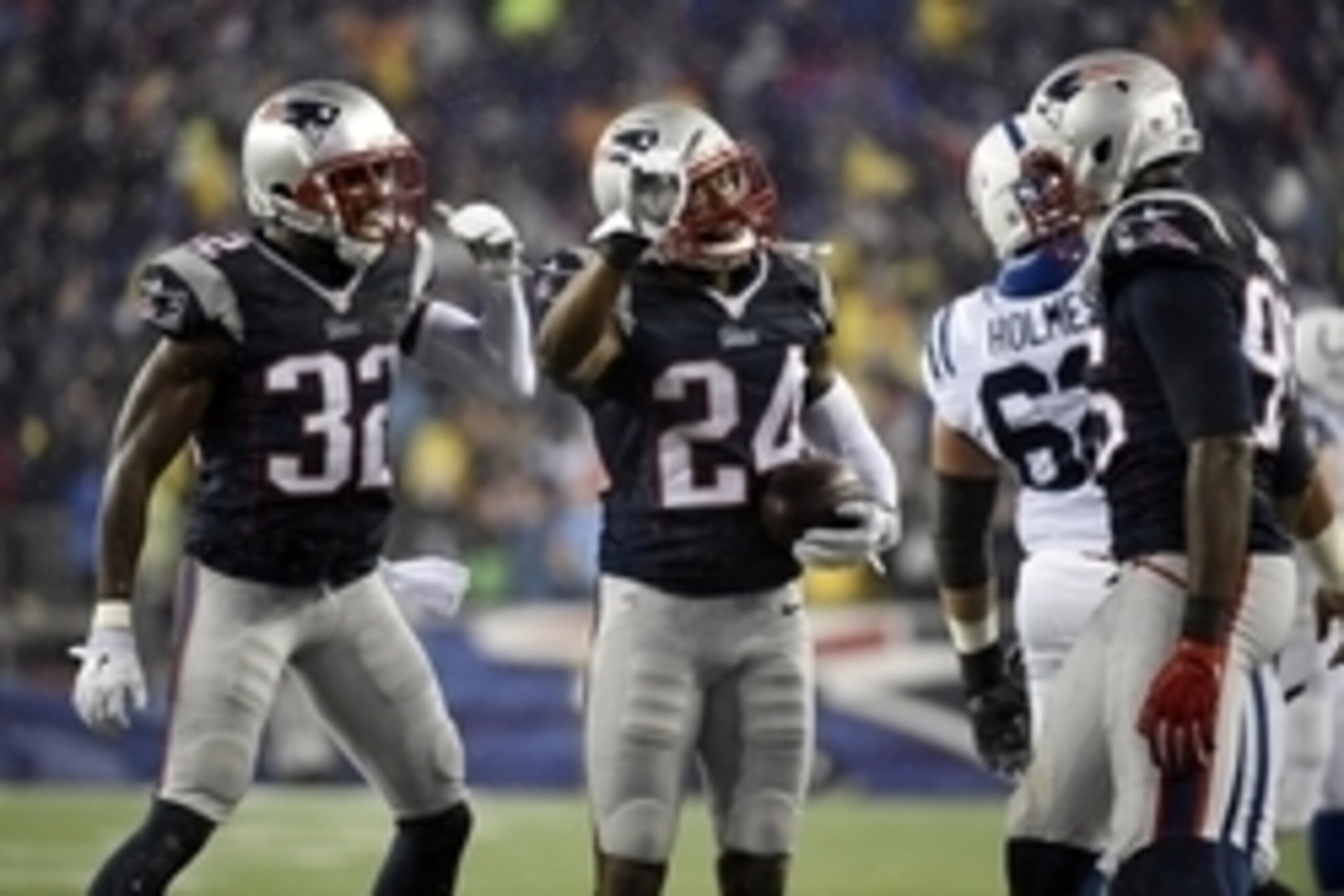 Jan 18, 2015; Foxborough, MA, USA; New England Patriots cornerback Darrelle Revis (24) reacts after intercepting a pass against the Indianapolis Colts in the third quarter in the AFC Championship Game at Gillette Stadium. Mandatory Credit: Robert Deutsch-
