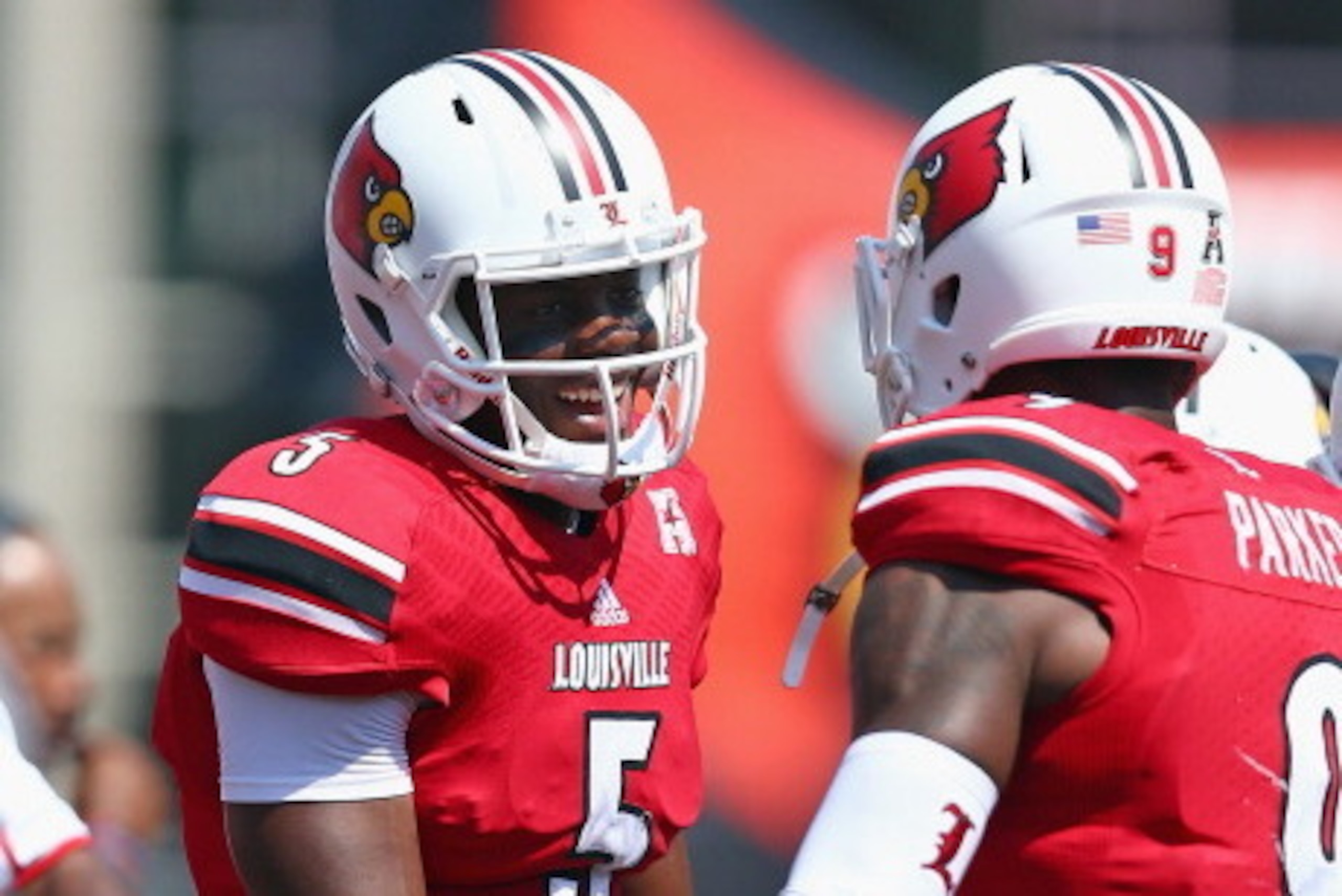 LOUISVILLE, KY - SEPTEMBER 07: Teddy Bridgewater #5 of the Louisville Cardinals celebrates with Devante Parker #9 after throwing a touchdown pass during the game against the Eastern Kentucky Colonels at Papa John's Cardinal Stadium on September 7, 2013 i LOUISVILLE, KY - SEPTEMBER 07: Teddy Bridgewater #5 of the Louisville Cardinals celebrates with Devante Parker #9 after throwing a touchdown pass during the game against the Eastern Kentucky Colonels at Papa John's Cardinal Stadium on September 7, 2013 i