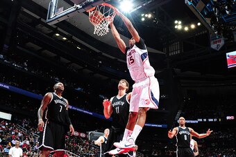 ATLANTA, GA - JANUARY 28: Al Horford #15 of the Atlanta Hawks dunks against the Brooklyn Nets on January 28, 2015 at Philips Arena in Atlanta, Georgia.  NOTE TO USER: User expressly acknowledges and agrees that, by downloading and/or using this Photograph
