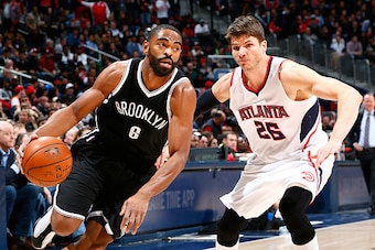 ATLANTA, GA - JANUARY 28:  Alan Anderson #6 of the Brooklyn Nets drives against Kyle Korver #26 of the Atlanta Hawks at Philips Arena on January 28, 2015 in Atlanta, Georgia.  NOTE TO USER: User expressly acknowledges and agrees that, by downloading and o