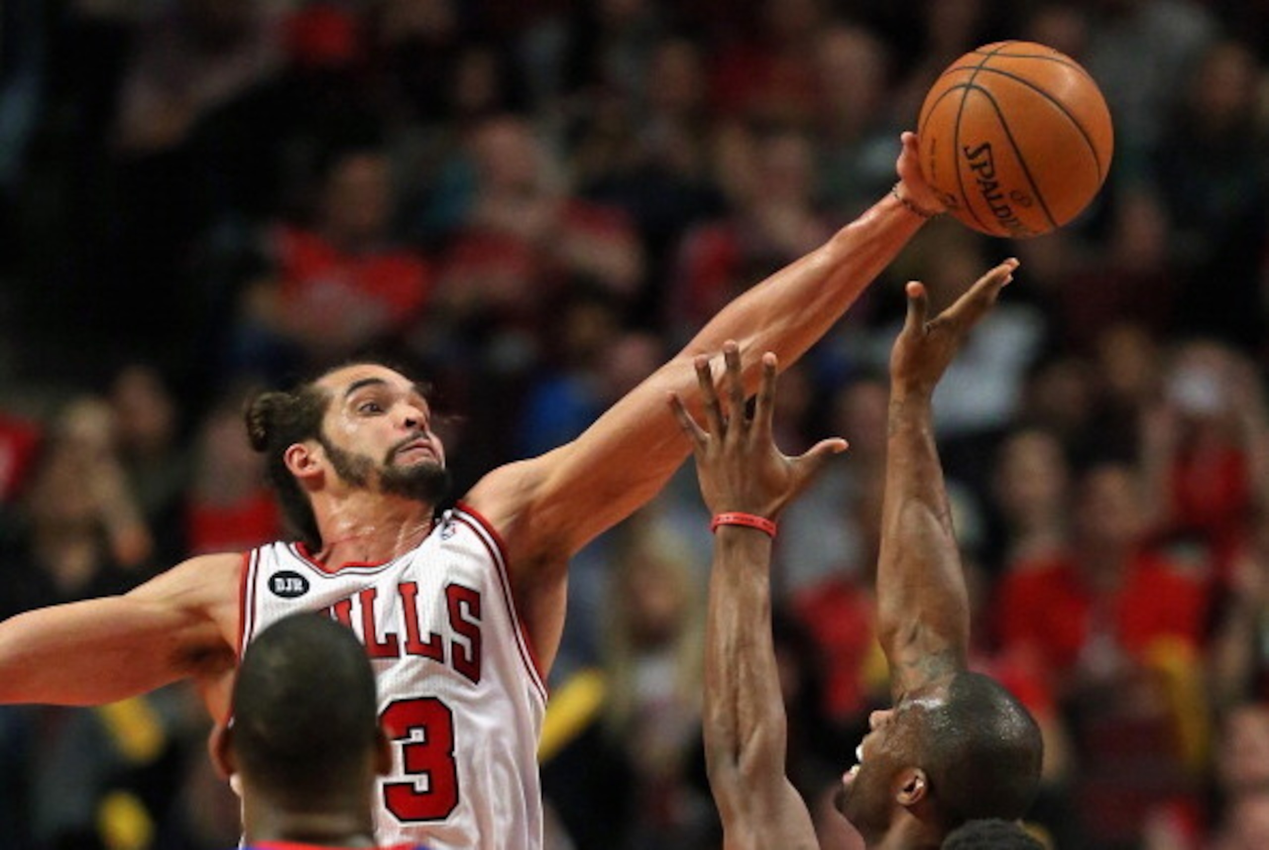 CHICAGO, IL - APRIL 11: Joakim Noah #13 of the Chicago Bulls blocks a shot by Rodney Stuckey #3 of the Detroit Pistons at the United Center on April 11, 2014 in Chicago, Illinois. The Bulls defeated the Pistons 106-98. NOTE TO USER: User expressly acknowl