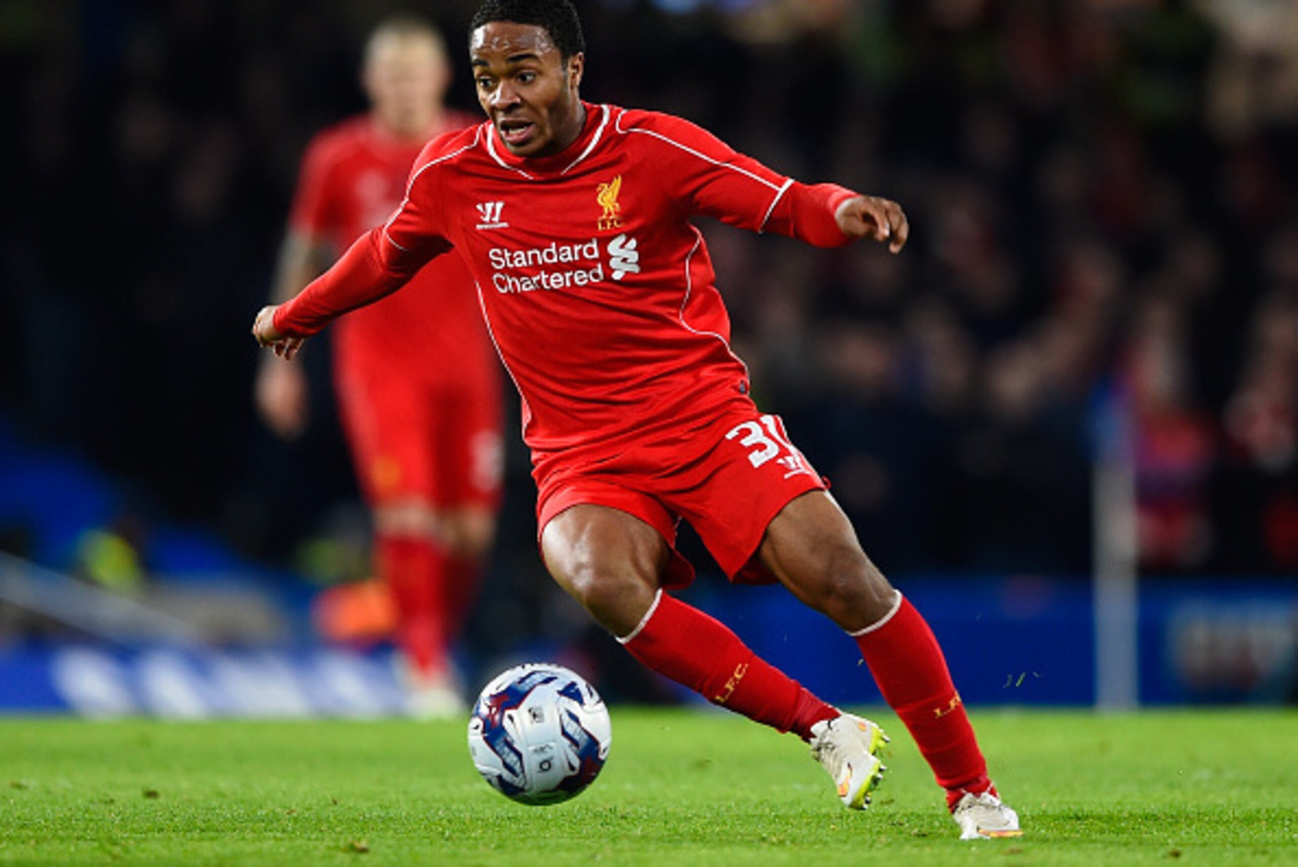 LONDON, ENGLAND - JANUARY 27:  Raheem Sterling of Liverpool on the ball during the Capital One Cup Semi-Final second leg between Chelsea and Liverpool at Stamford Bridge on January 27, 2015 in London, England.  (Photo by Mike Hewitt/Getty Images)