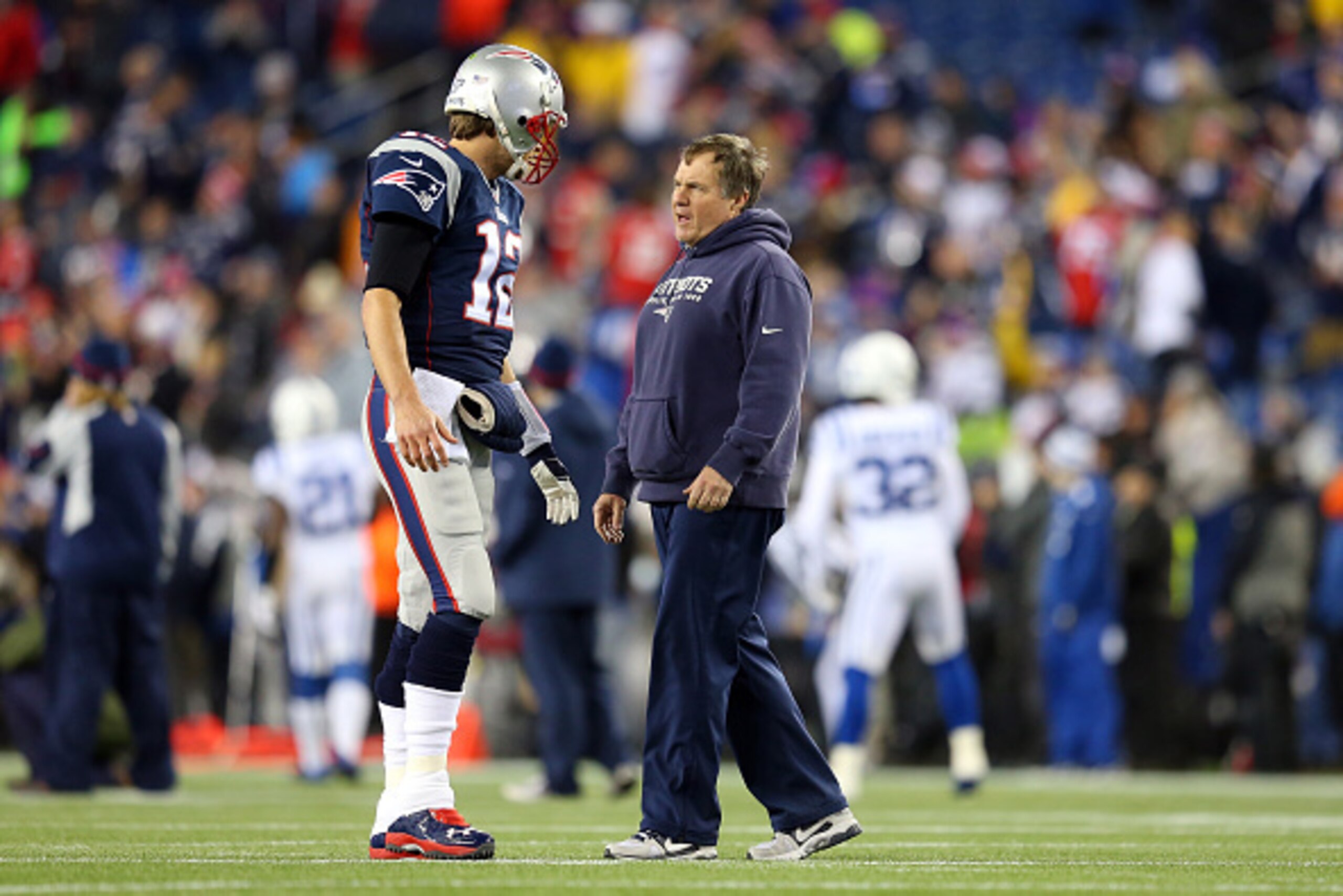 FOXBORO, MA - JANUARY 18:  Tom Brady #12 of the New England Patriots talks with head coach Bill Belichick prior to the 2015 AFC Championship Game against the Indianapolis Colts at Gillette Stadium on January 18, 2015 in Foxboro, Massachusetts.  (Photo by 