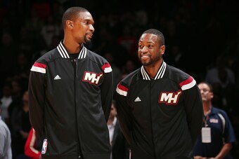 WASHINGTON,DC - December 1: Chris Bosh #1 and Dwyane Wade #3 of the Miami Heat stand on the court before the national anthem before the game against the Washington Wizards on December 1, 2014 at Verizon Center in Washington, DC. NOTE TO USER: User express