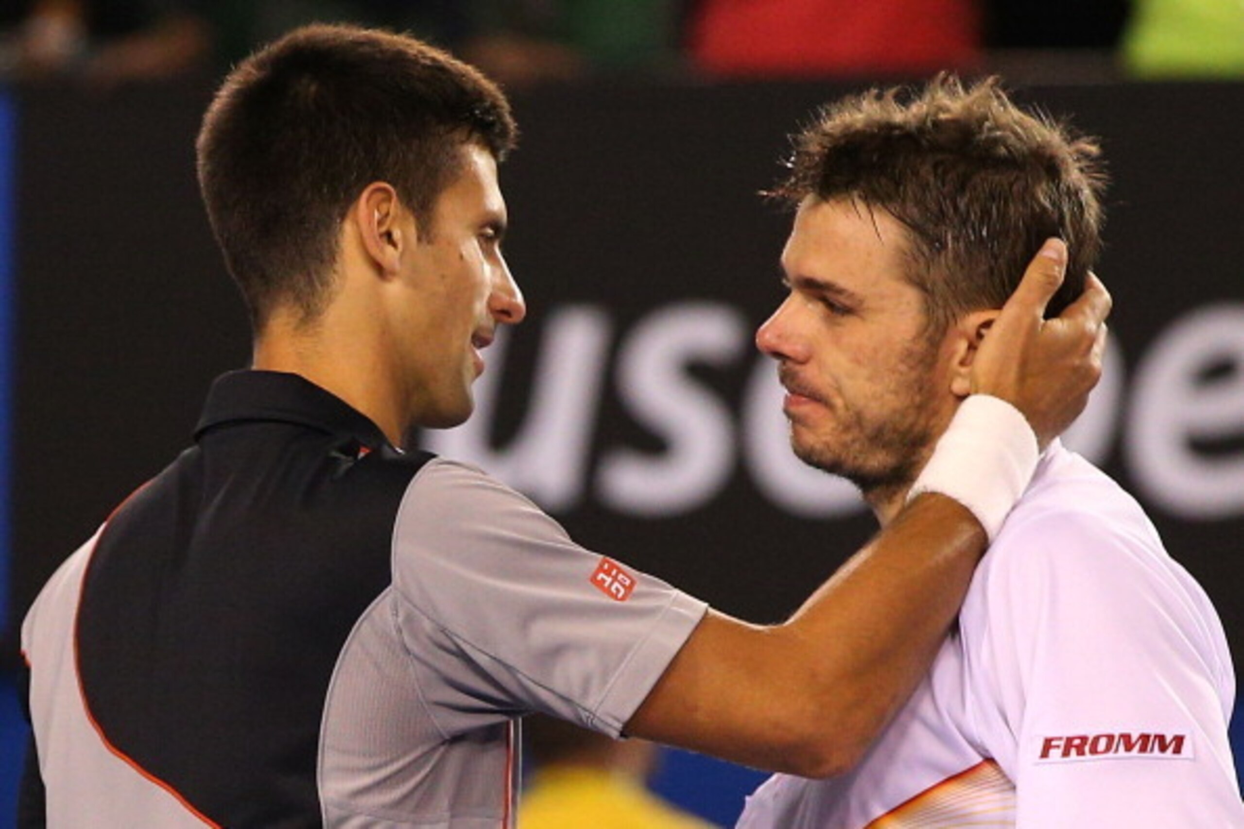 MELBOURNE, AUSTRALIA - JANUARY 21:  Stanislas Wawrinka (R) of Switzerland celebrates winning in his quarterfinal match against Novak Djokovic of Serbia  during the 2014 Australian Open at Melbourne Park on January 21, 2014 in Melbourne, Australia.  (Photo
