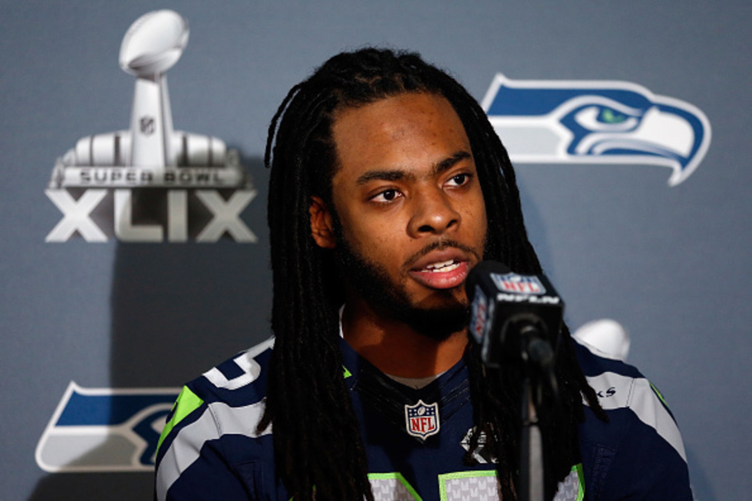 CHANDLER, AZ - JANUARY 28:  Cornerback Richard Sherman #25 of the Seattle Seahawks speaks during a Super Bowl XLIX media availability at the Arizona Grand Hotel on January 28, 2015 in Chandler, Arizona.  (Photo by Christian Petersen/Getty Images)