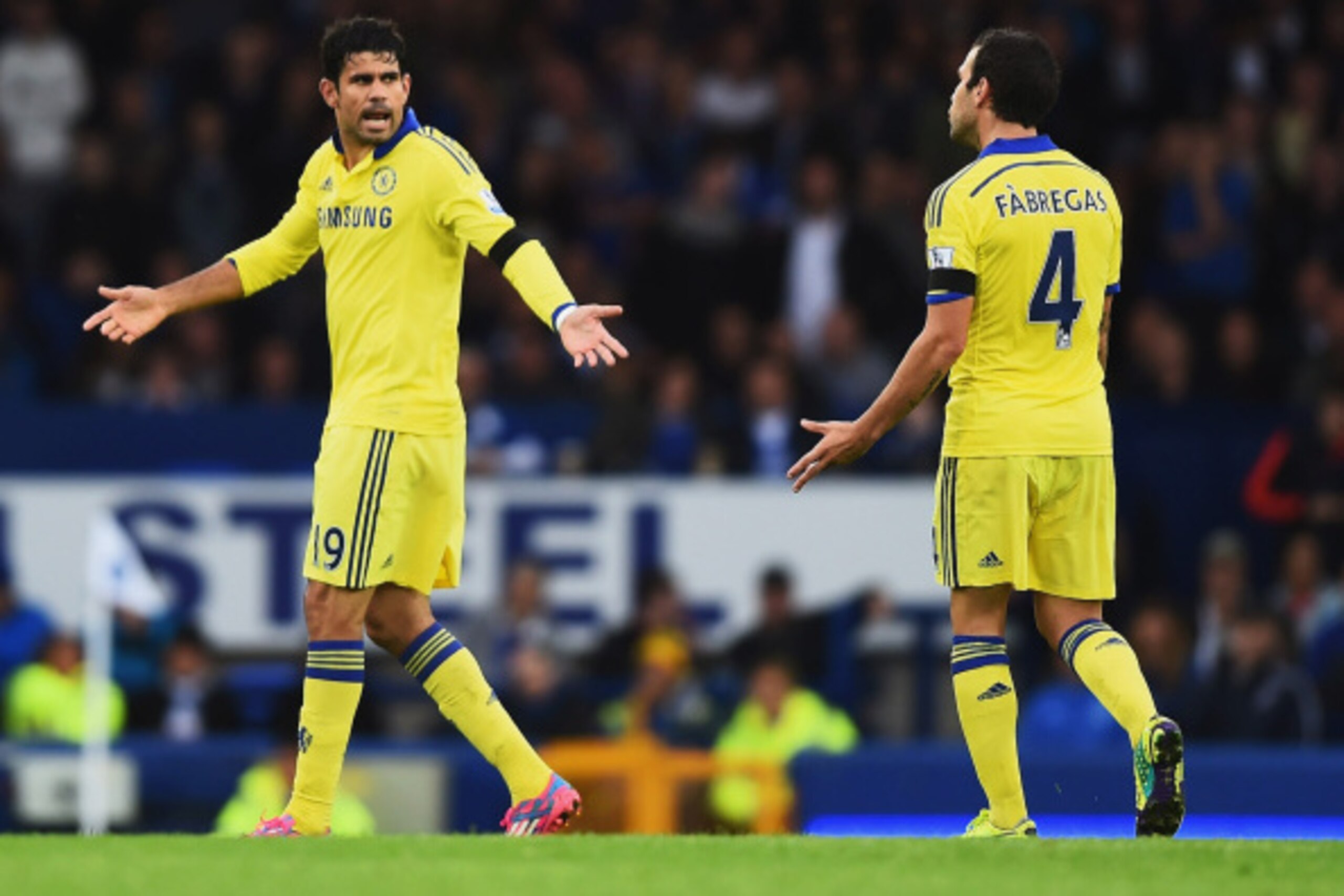 LIVERPOOL, ENGLAND - AUGUST 30: Diego Costa of Chelsea exchanges words with Cesc Fabregas of Chelsea during the Barclays Premier League match between Everton and Chelsea at Goodison Park on August 30, 2014 in Liverpool, England.  (Photo by Laurence Griffi