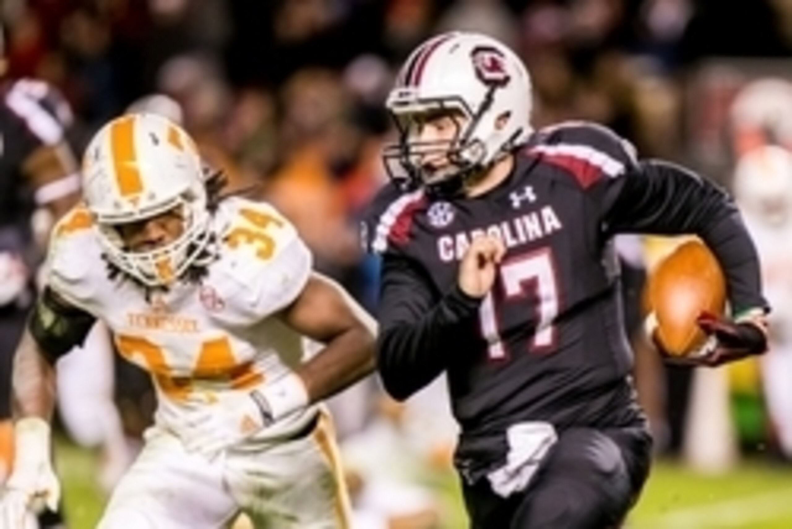 Nov 1, 2014; Columbia, SC, USA; South Carolina Gamecocks quarterback Dylan Thompson (17) scrambles away from Tennessee Volunteers linebacker Jalen Reeves-Maybin (34) in the fourth quarter at Williams-Brice Stadium. Mandatory Credit: Jeff Blake-USA TODAY S Nov 1, 2014; Columbia, SC, USA; South Carolina Gamecocks quarterback Dylan Thompson (17) scrambles away from Tennessee Volunteers linebacker Jalen Reeves-Maybin (34) in the fourth quarter at Williams-Brice Stadium. Mandatory Credit: Jeff Blake-USA TODAY S