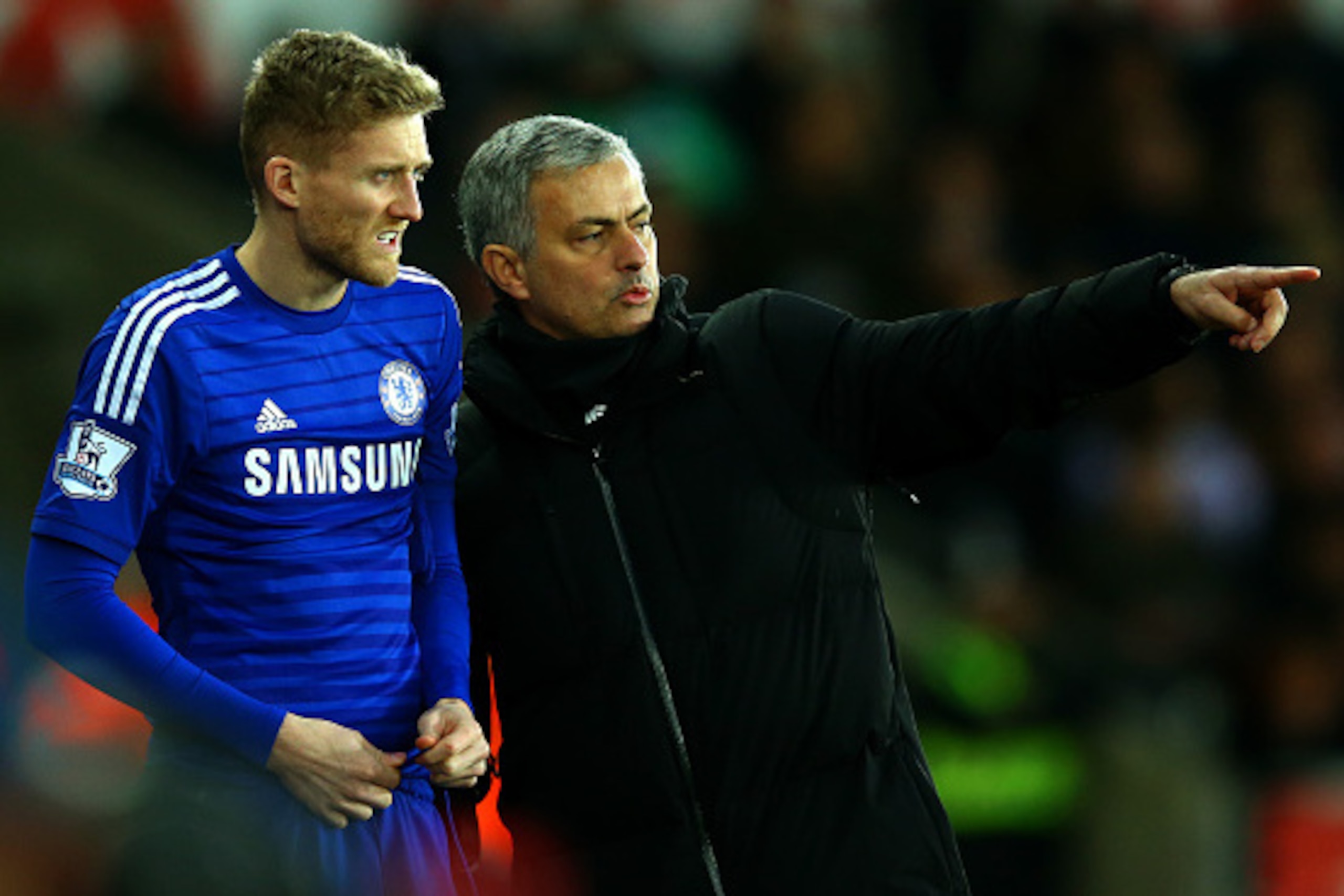 SWANSEA, WALES - JANUARY 17:  Jose Mourinho, manager of Chelsea speaks with Andre Schuerrle of Chelsea as he prepares to gon on during the Barclays Premier League match between Swansea City and Chelsea at Liberty Stadium on January 17, 2015 in Swansea, Wa