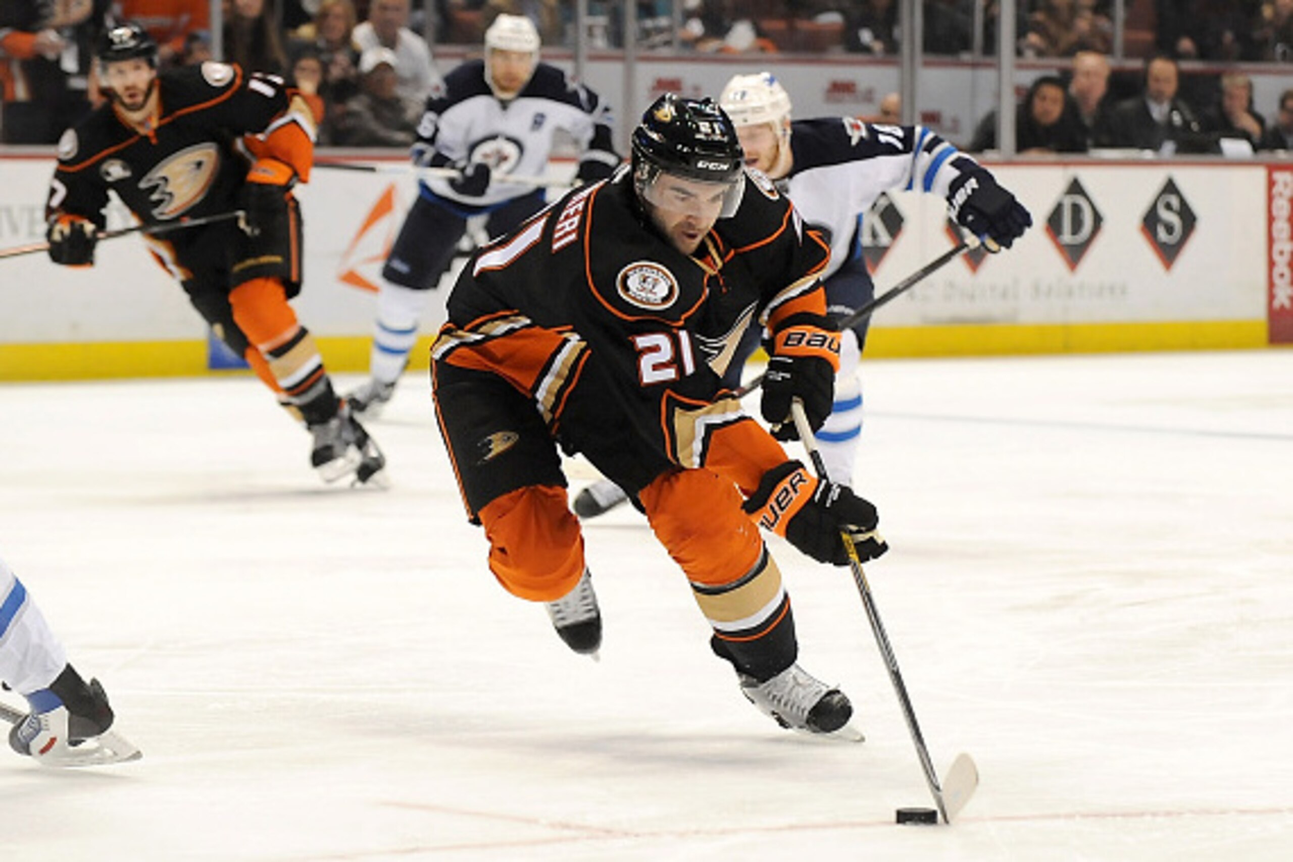 ANAHEIM, CA - JANUARY 11:  Kyle Palmieri #21 of the Anaheim Ducks handles the puck during an NHL game against the Winnipeg Jets at Honda Center on January 11, 2015 in Anaheim, California.  (Photo by Jonathan Moore/Getty Images)