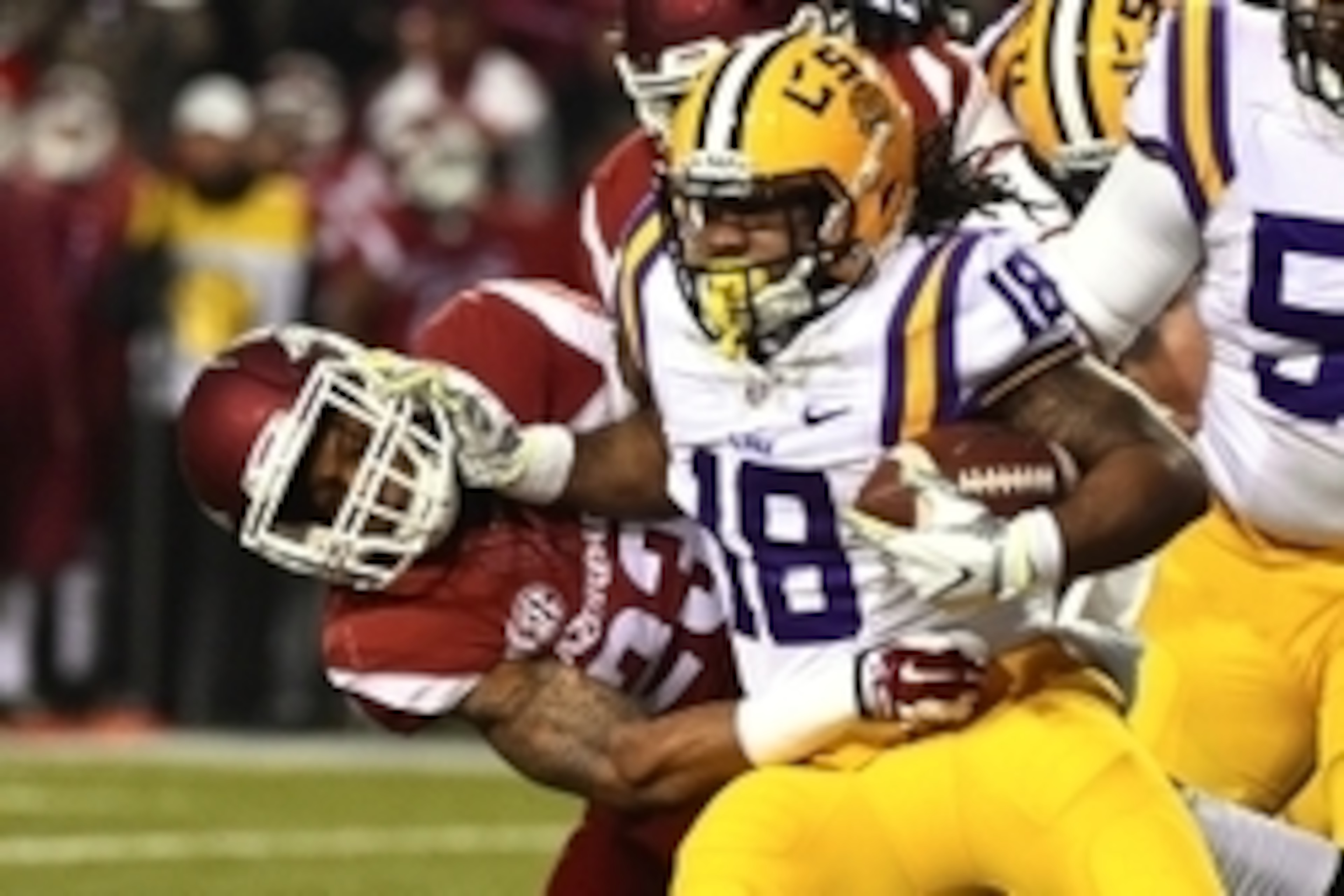 Nov 15, 2014; Fayetteville, AR, USA; Arkansas Razorbacks linebacker Braylon Mitchell (34) tackles LSU Tigers running back Terrence Magee (18) during the first half at Donald W. Reynolds Razorback Stadium. Mandatory Credit: Jasen Vinlove-USA TODAY Sports Nov 15, 2014; Fayetteville, AR, USA; Arkansas Razorbacks linebacker Braylon Mitchell (34) tackles LSU Tigers running back Terrence Magee (18) during the first half at Donald W. Reynolds Razorback Stadium. Mandatory Credit: Jasen Vinlove-USA TODAY Sports