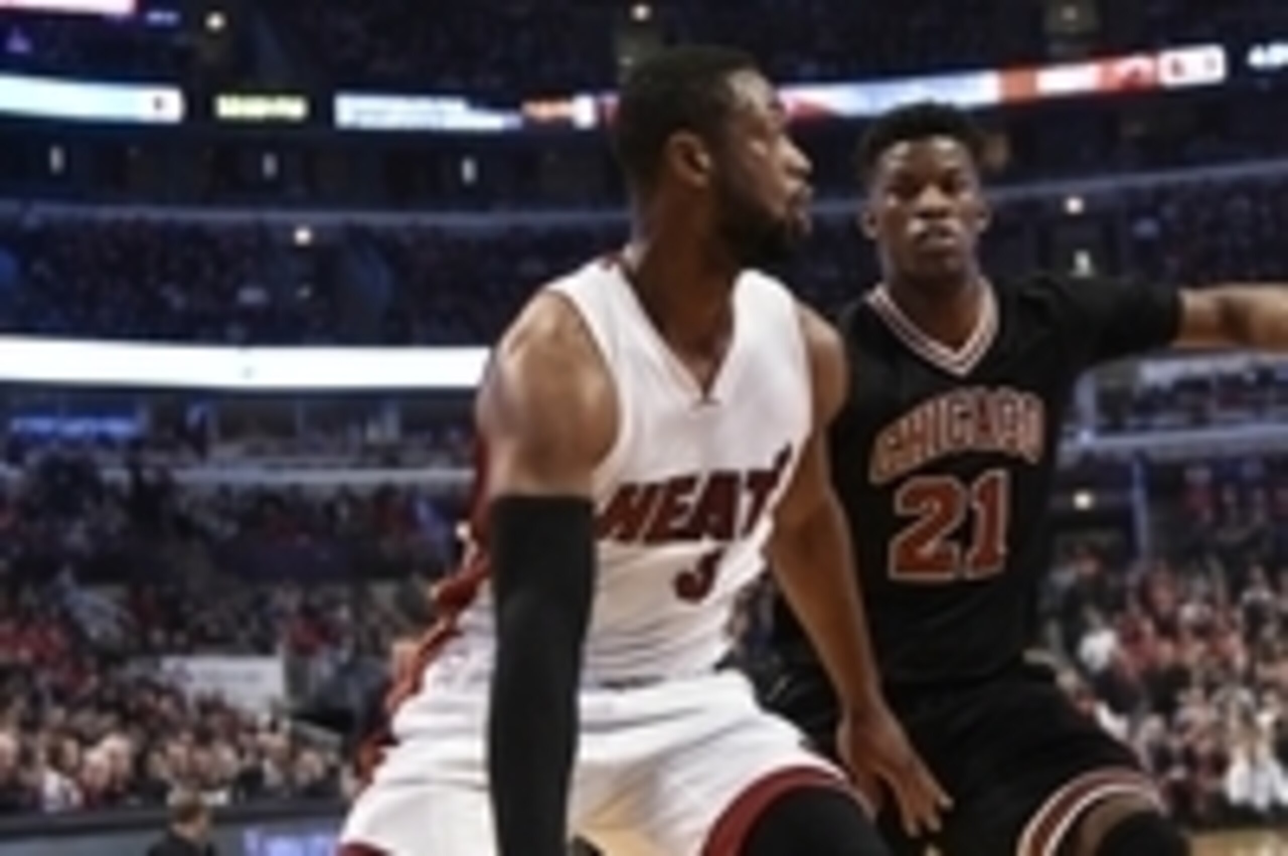 Jan 25, 2015; Chicago, IL, USA; Miami Heat guard Dwyane Wade (3) drives past Chicago Bulls guard Jimmy Butler (21) during the first half at  the United Center. Mandatory Credit: David Banks-USA TODAY Sports