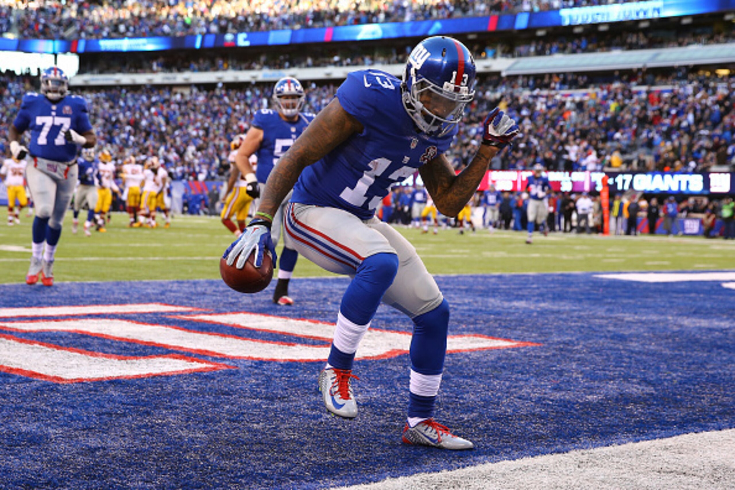 EAST RUTHERFORD, NJ - DECEMBER 14:  Odell Beckham Jr. #13 of the New York Giants celebrates after an attempted 30 yard touchdown that was nullified due to a penalty in the fourth quarter during their game against the Washington Redskins at MetLife Stadium