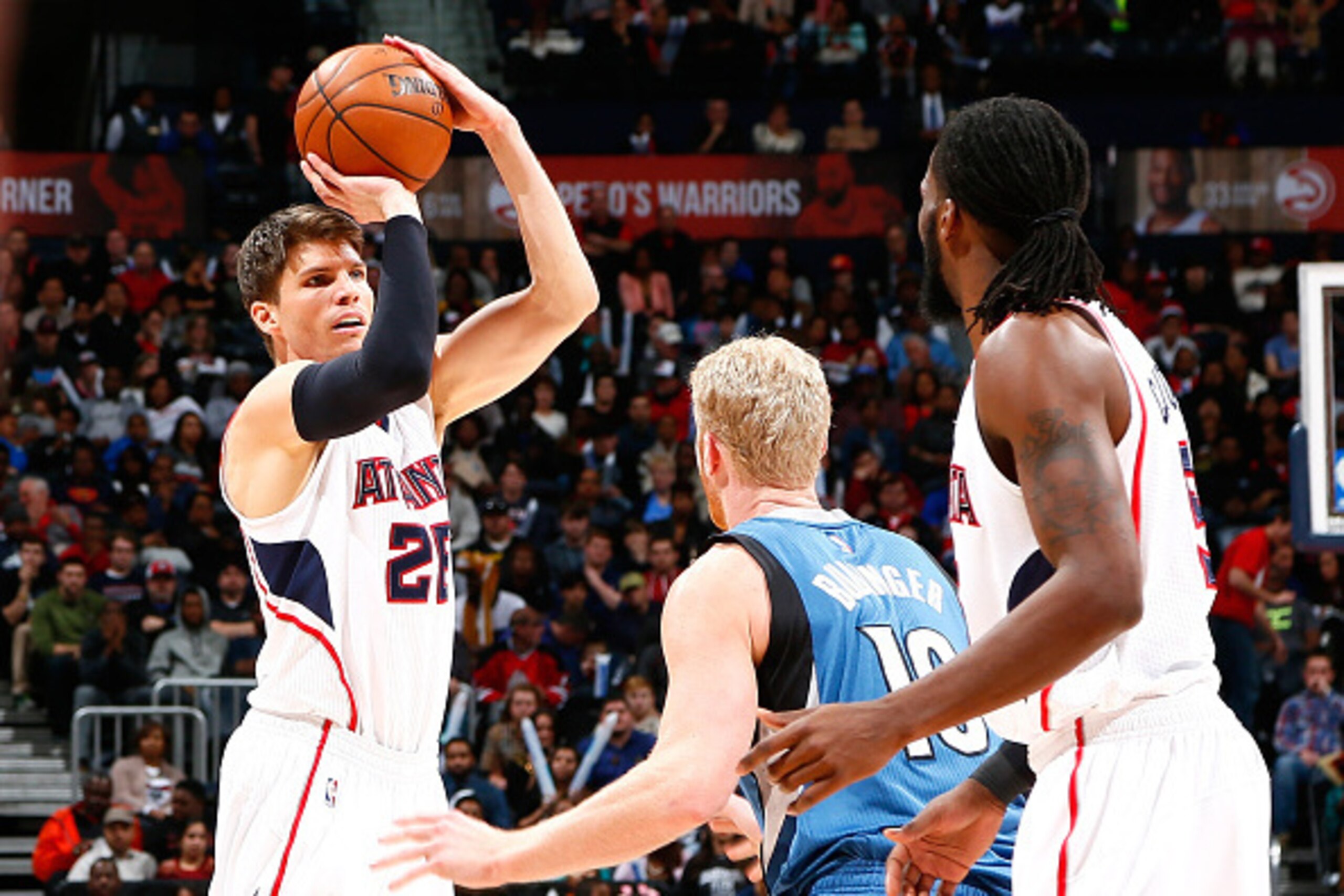 ATLANTA, GA - JANUARY 25:  Kyle Korver #26 of the Atlanta Hawks against Chase Budinger #10 of the Minnesota Timberwolves at Philips Arena on January 25, 2015 in Atlanta, Georgia.  NOTE TO USER: User expressly acknowledges and agrees that, by downloading a