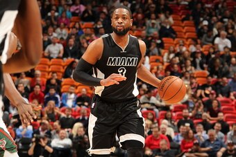 MIAMI, FL - JANUARY 27:  Dwyane Wade #3 of the Miami Heat brings the ball up court against the Milwaukee Bucks on January 27, 2015  at American Airlines Arena in Miami, Florida.  NOTE TO USER: User expressly acknowledges and agrees that, by downloading an