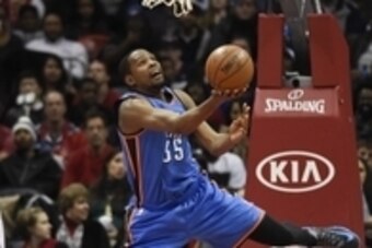 Jan 23, 2015; Atlanta, GA, USA; Oklahoma City Thunder forward Kevin Durant (35) tries to score after being fouled by Atlanta Hawks forward Pero Antic (6) during the second half at Philips Arena. The Hawks defeated the Thunder 103-93. Mandatory Credit: Dal