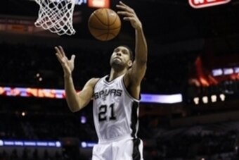 Jan 28, 2015; San Antonio, TX, USA; San Antonio Spurs power forward Tim Duncan (21) grabs a rebound during the second half against the Charlotte Hornets at AT&T Center. Mandatory Credit: Soobum Im-USA TODAY Sports