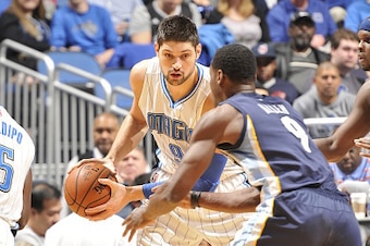 ORLANDO, FL - JANUARY 16:  Nikola Vucevic #9 of the Orlando Magic handles the ball against Tony Allen #9 of the Memphis Grizzlies on January 16, 2015 at Amway Center in Orlando, Florida. NOTE TO USER: User expressly acknowledges and agrees that, by downlo