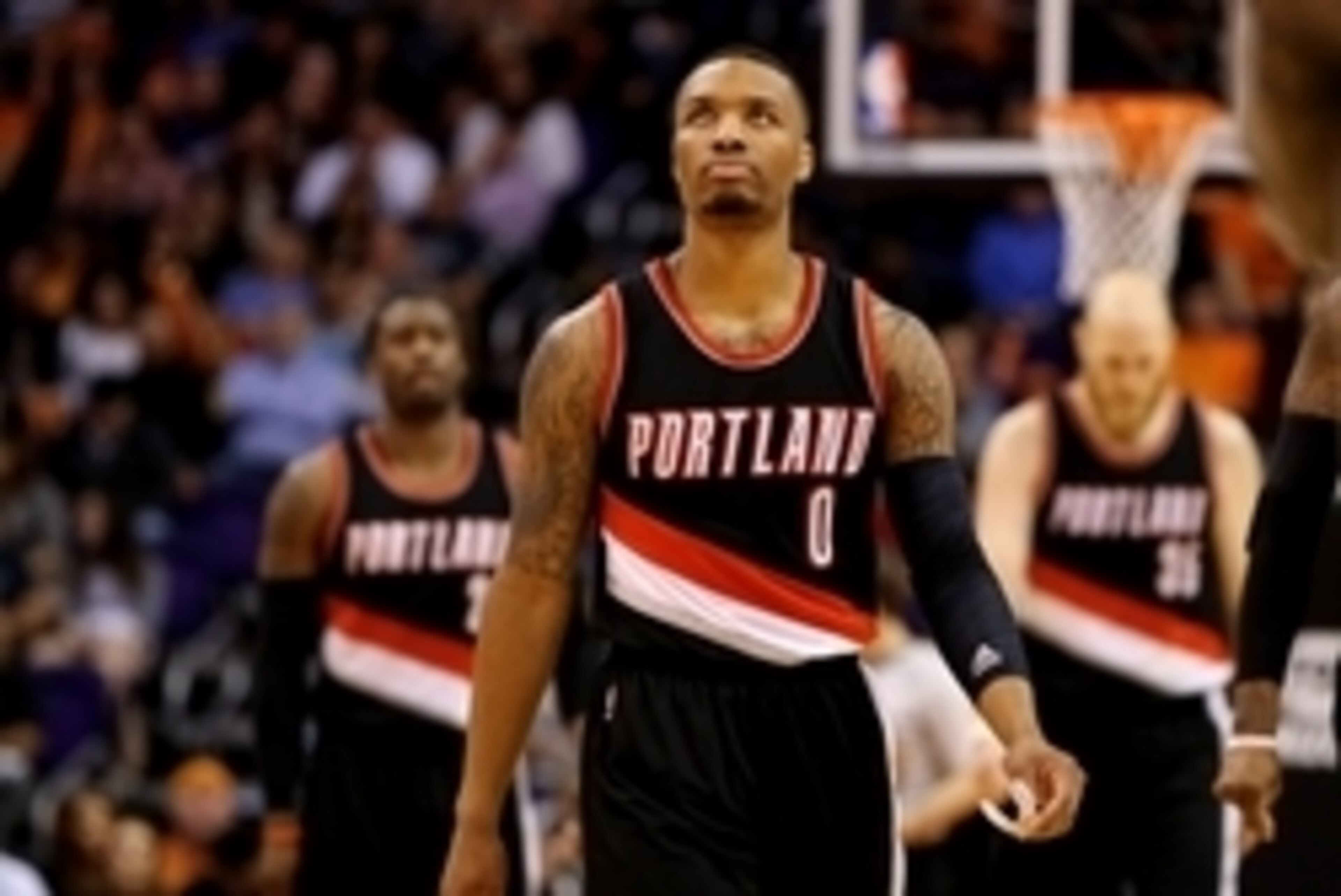 Jan 21, 2015; Phoenix, AZ, USA; Portland Trail Blazers guard Damian Lillard (0) against the Phoenix Suns at US Airways Center. The Suns defeated the Blazers 118-113. Mandatory Credit: Mark J. Rebilas-USA TODAY Sports