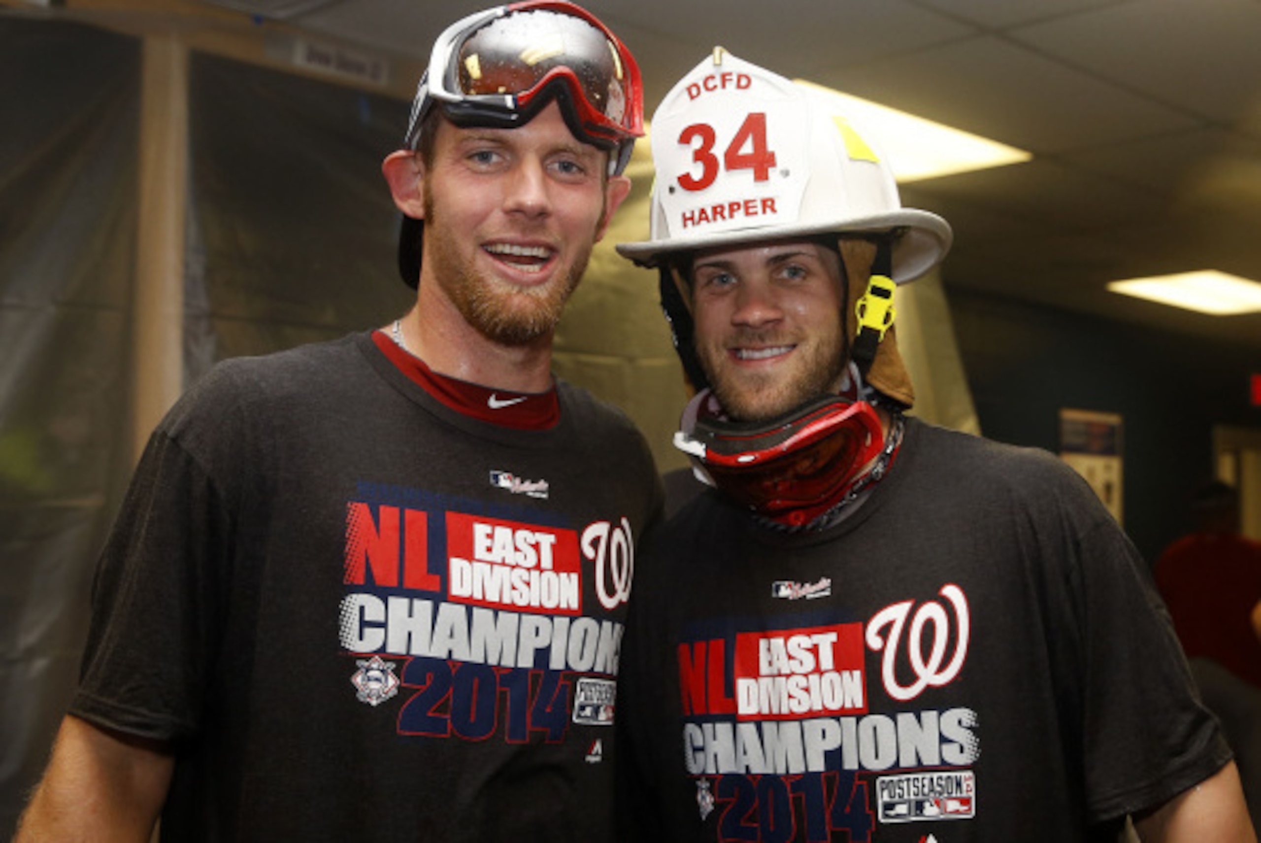 ATLANTA, GA - SEPTEMBER 16: Pitcher Stephen Strasburg #38 of the Washington Nationals (left) poses with teammate Bryce Harper #34 after the division clinching game against the Atlanta Braves at Turner Field on September 16, 2014 in Atlanta, Georgia. (Ph ATLANTA, GA - SEPTEMBER 16: Pitcher Stephen Strasburg #38 of the Washington Nationals (left) poses with teammate Bryce Harper #34 after the division clinching game against the Atlanta Braves at Turner Field on September 16, 2014 in Atlanta, Georgia. (Ph