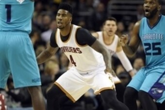 Jan 23, 2015; Cleveland, OH, USA; Cleveland Cavaliers guard Iman Shumpert (4) defends Charlotte Hornets guard Lance Stephenson (1) during the second half at Quicken Loans Arena. The Cavs won 129-90. Mandatory Credit: Ken Blaze-USA TODAY Sports