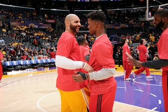 LOS ANGELES, CA - JANUARY 29: Carlos Boozer #5 of the Los Angeles Lakers and Jimmy Butler #21 of the Chicago Bulls exchange words before a game at STAPLES Center on January 29, 2015 in Los Angeles, California. NOTE TO USER: User expressly acknowledges and