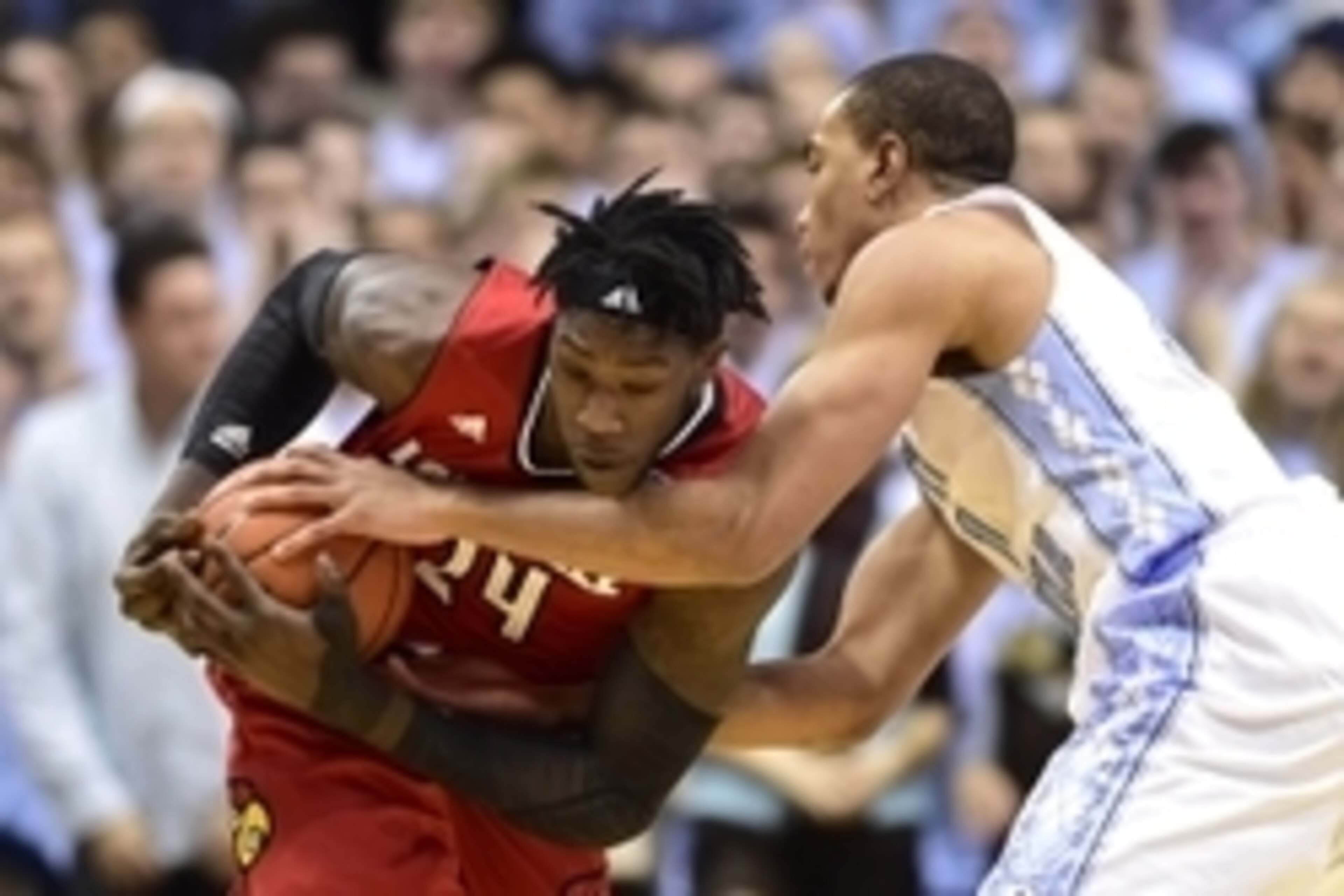 Jan 10, 2015; Chapel Hill, NC, USA; Louisville Cardinals forward Montrezl Harrell (24) fights for the ball with North Carolina Tar Heels forward Brice Johnson (11) in the first half at Dean E. Smith Center. Mandatory Credit: Bob Donnan-USA TODAY Sports