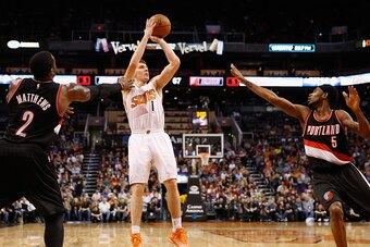 PHOENIX, AZ - JANUARY 21:  Goran Dragic #1 of the Phoenix Suns puts up a shot over Will Barton #5 of the Portland Trail Blazers during the second half of the NBA game at US Airways Center on January 21, 2015 in Phoenix, Arizona. The Suns defeated the Trai