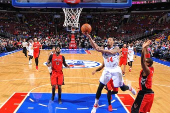 PHILADELPHIA, PA - JANUARY 23: K.J. McDaniels #14 of the Philadelphia 76ers goes up for the layup against the Toronto Raptors at Wells Fargo Center on January 23, 2015 in Philadelphia, Pennsylvania NOTE TO USER: User expressly acknowledges and agrees that