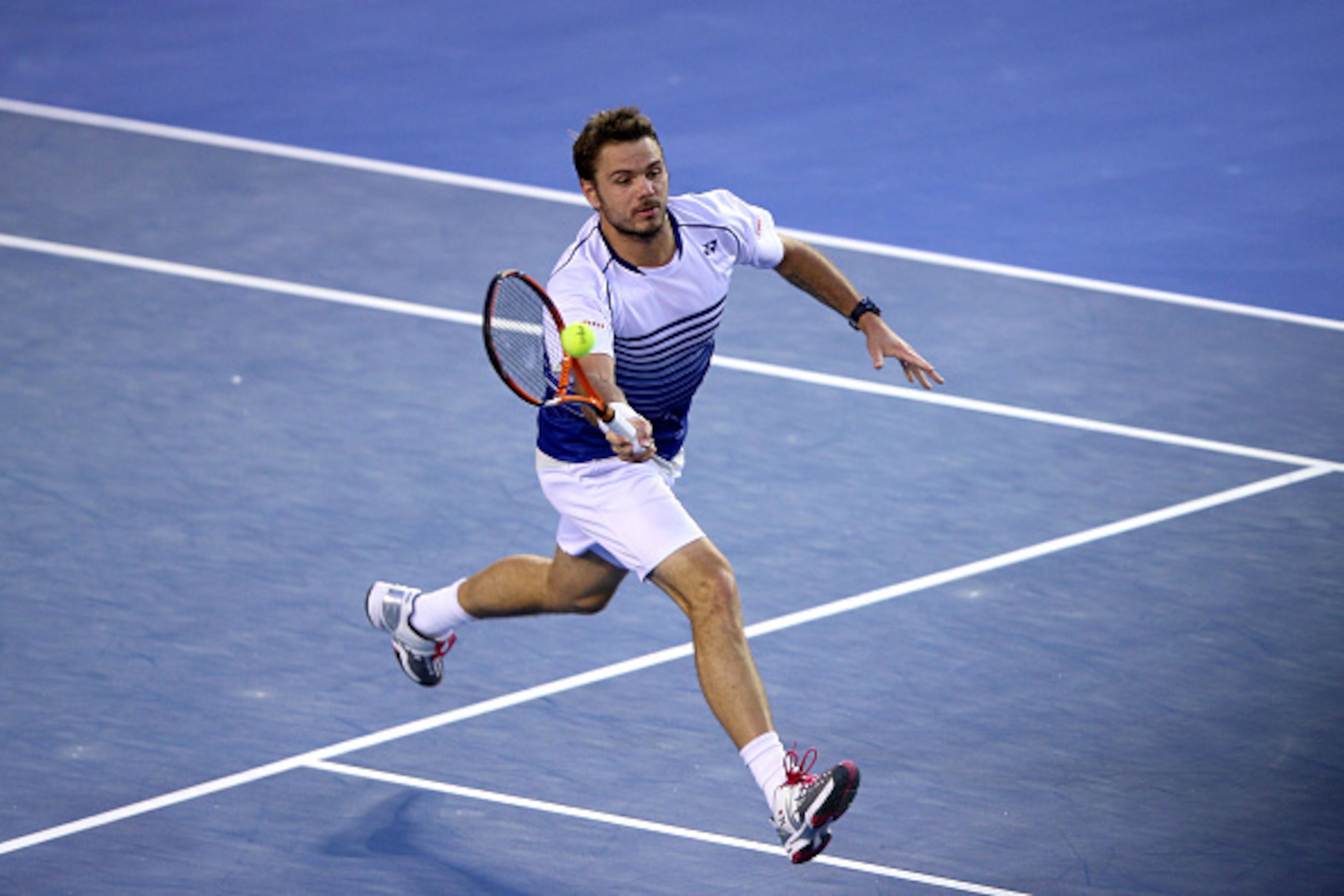 MELBOURNE, AUSTRALIA - JANUARY 30:  Stanislas Wawrinka of Switzerland plays a forehand in his semifinal match against Novak Djokovic of Serbia during day 12 of the 2015 Australian Open at Melbourne Park on January 30, 2015 in Melbourne, Australia.  (Photo