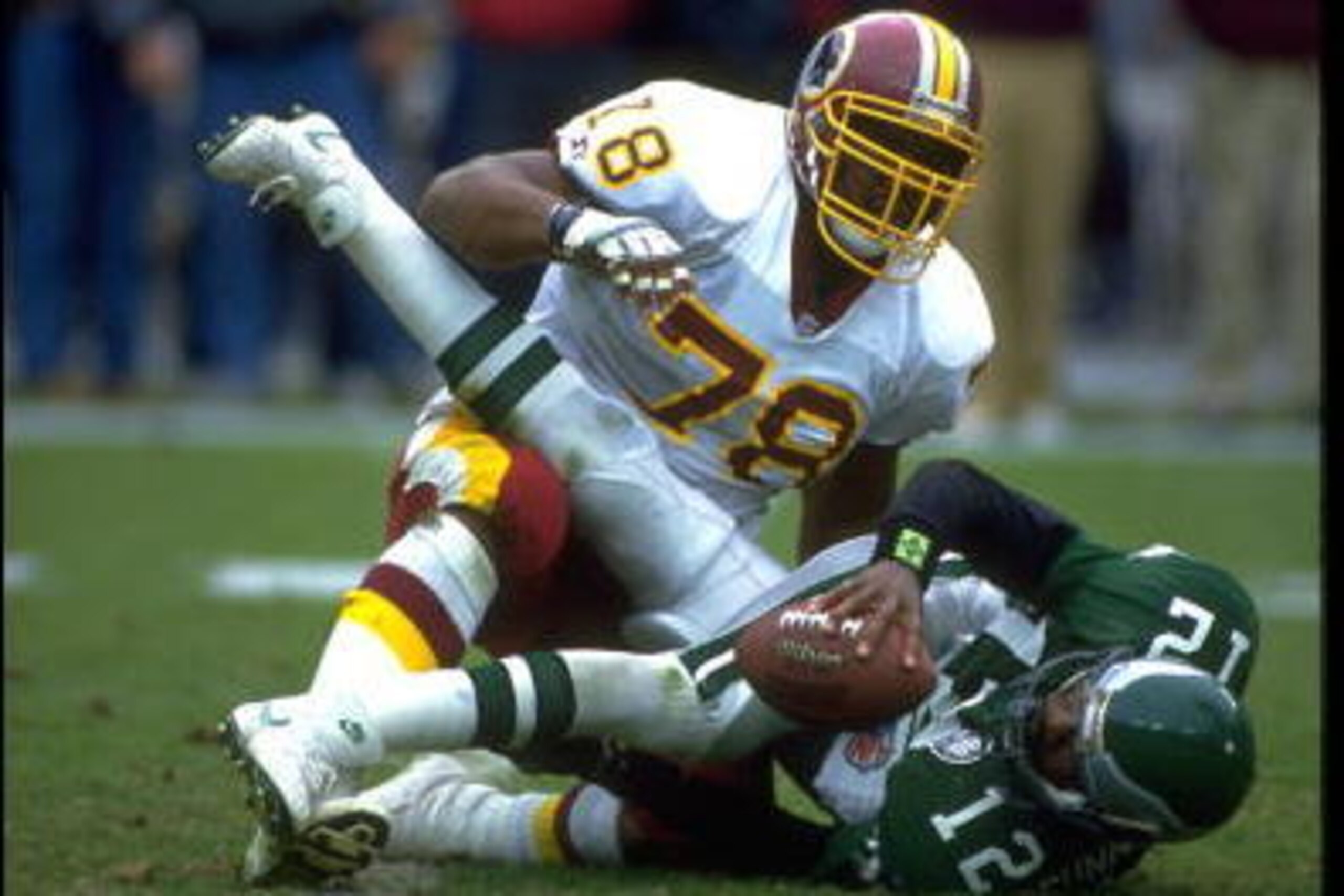 18 OCT 1992:  WASHINGTON REDSKINS DEFENSIVE LINEMAN TIM JOHNSON SACKS PHILADELPHIA EAGLES QUARTERBACK RANDALL CUNNINGHAM DURING REDSKINS 16-12 VICTORY THE EAGLES AT RFK STADIUM IN WASHINGTON D.C.