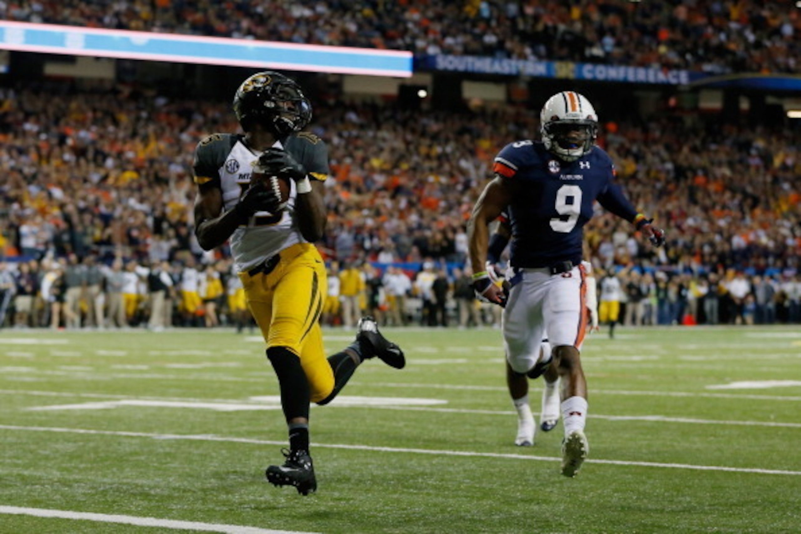 ATLANTA, GA - DECEMBER 07:  Dorial Green-Beckham #15 of the Missouri Tigers scores a touchdown in the second quarter against Jermaine Whitehead #9 of the Auburn Tigers during the SEC Championship Game at Georgia Dome on December 7, 2013 in Atlanta, Georgi