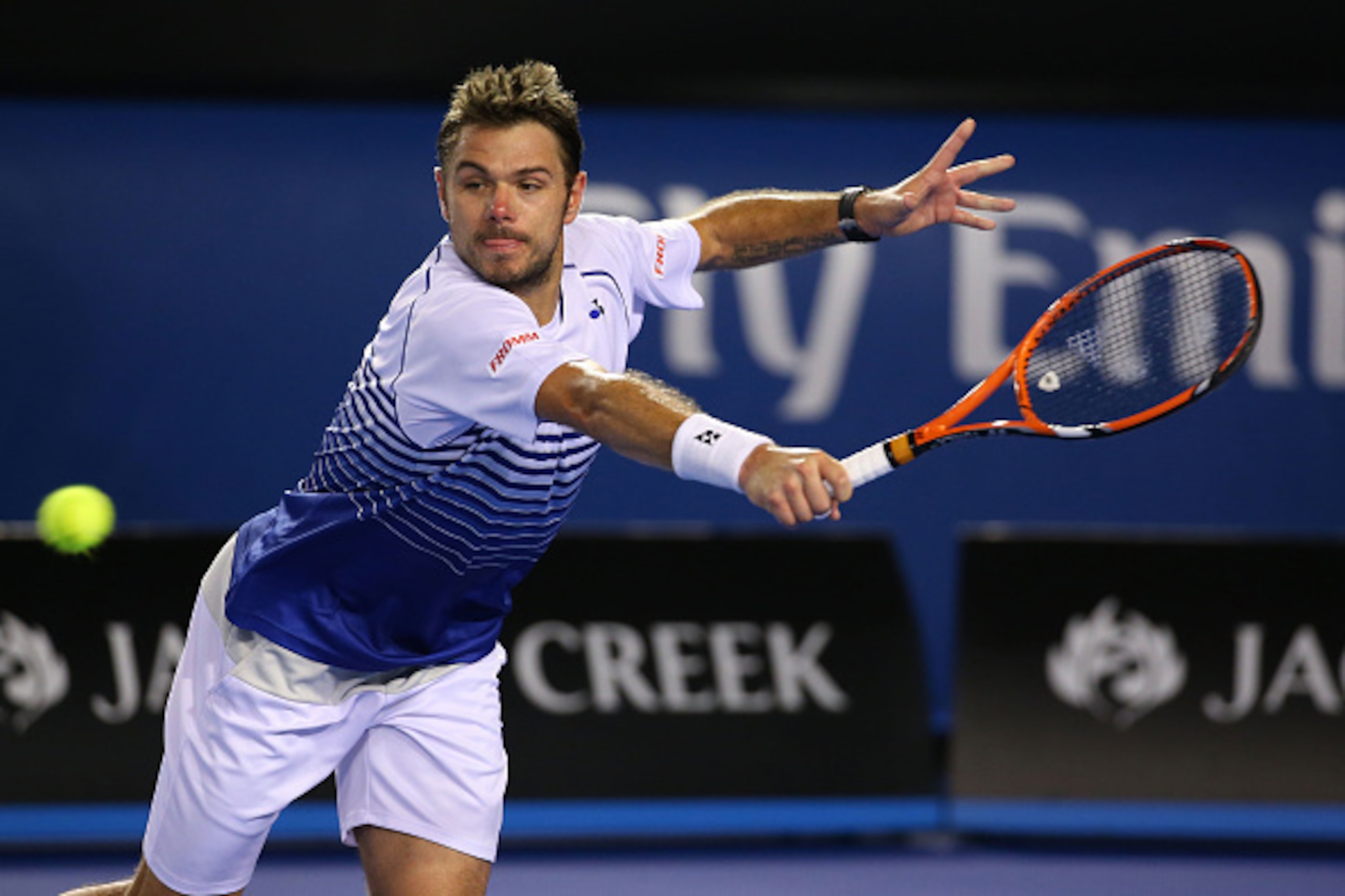 MELBOURNE, AUSTRALIA - JANUARY 30: Stanislas Wawrinka of Switzerland plays a backhand in his semifinal match against Novak Djokovic of Serbia during day 12 of the 2015 Australian Open at Melbourne Park on January 30, 2015 in Melbourne, Australia. (Photo MELBOURNE, AUSTRALIA - JANUARY 30: Stanislas Wawrinka of Switzerland plays a backhand in his semifinal match against Novak Djokovic of Serbia during day 12 of the 2015 Australian Open at Melbourne Park on January 30, 2015 in Melbourne, Australia. (Photo