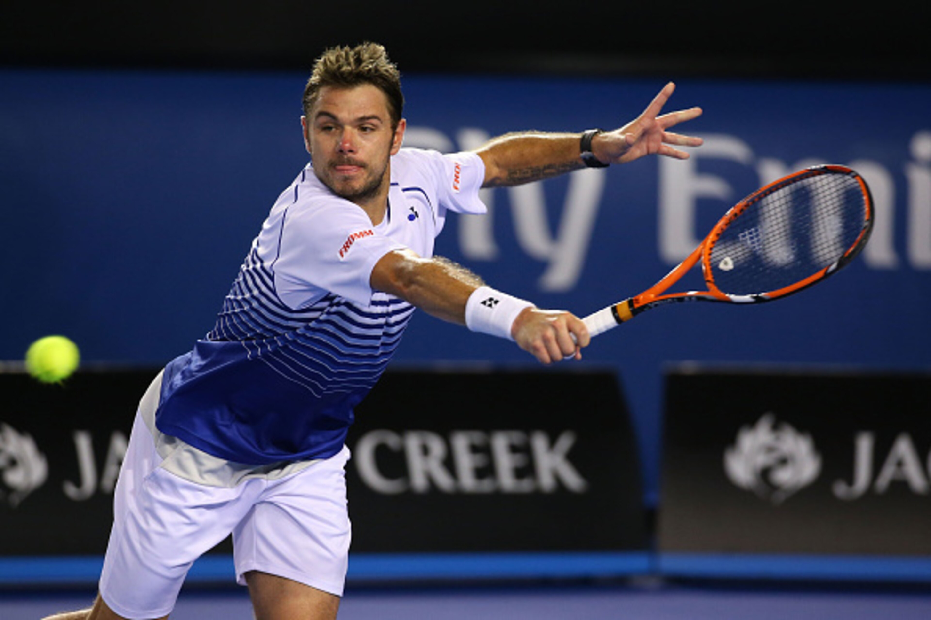 MELBOURNE, AUSTRALIA - JANUARY 30:  Stanislas Wawrinka of Switzerland plays a backhand in his semifinal match against Novak Djokovic of Serbia during day 12 of the 2015 Australian Open at Melbourne Park on January 30, 2015 in Melbourne, Australia.  (Photo
