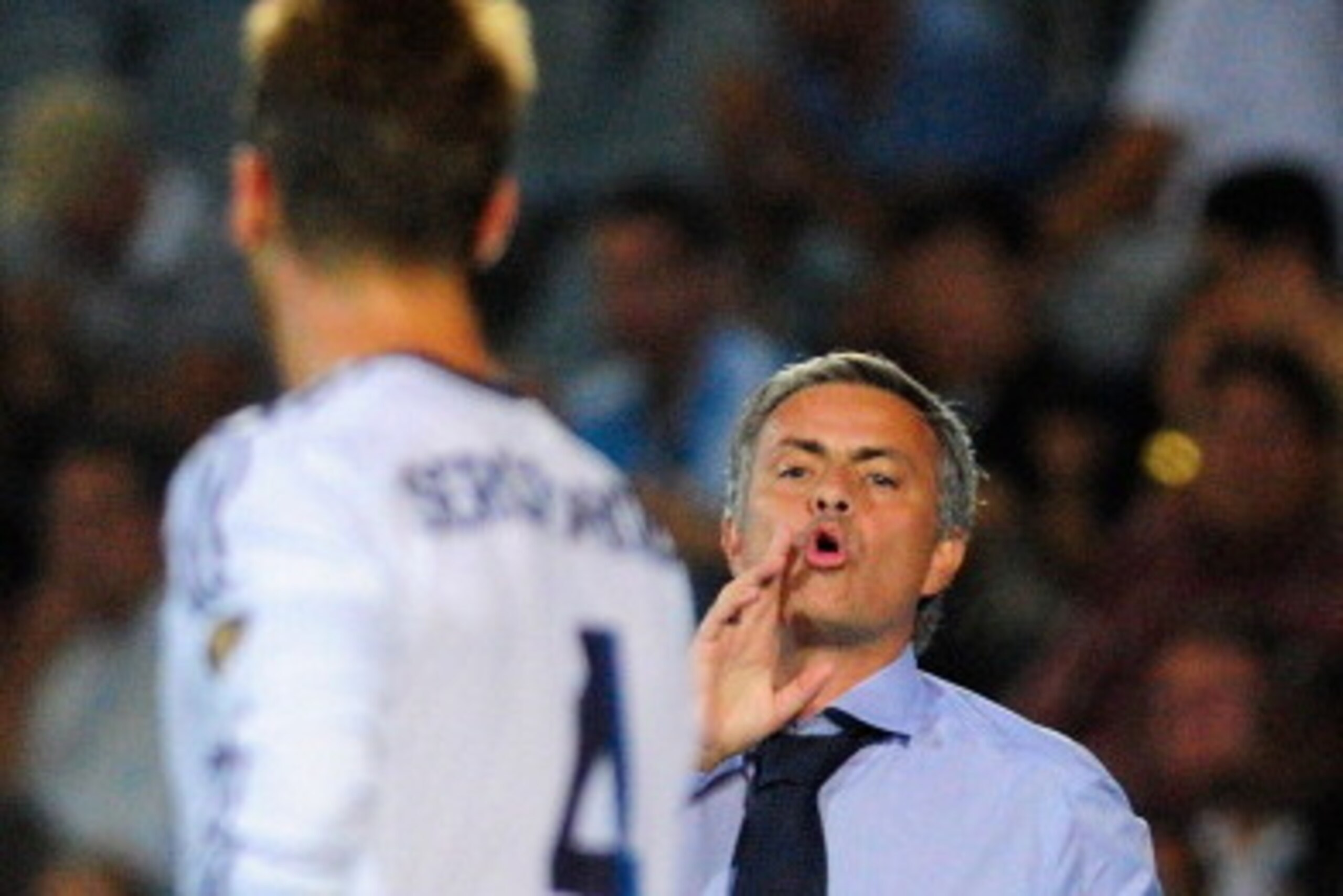 GETAFE, SPAIN - AUGUST 26: Head Coach Jose Mourinho of Real Madrid gives instrucctions to Sergio Ramos during the la Liga match between Getafe and Real Madrid at Coliseum Alfonso Perez on August 26, 2012 in Getafe, Spain.  (Photo by Gonzalo Arroyo Moreno/