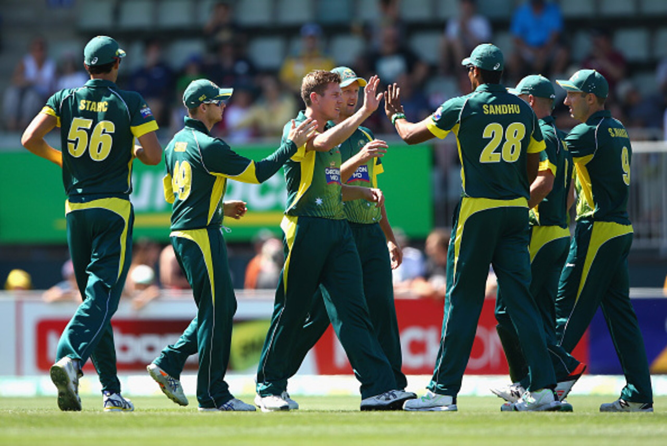HOBART, AUSTRALIA - JANUARY 23: James Faulkner of Australia celebrates the wicket of Moeen Ali of England during the One Day International Tri Series match between Australia and England at Blundstone Arena on January 23, 2015 in Hobart, Australia.  (Photo
