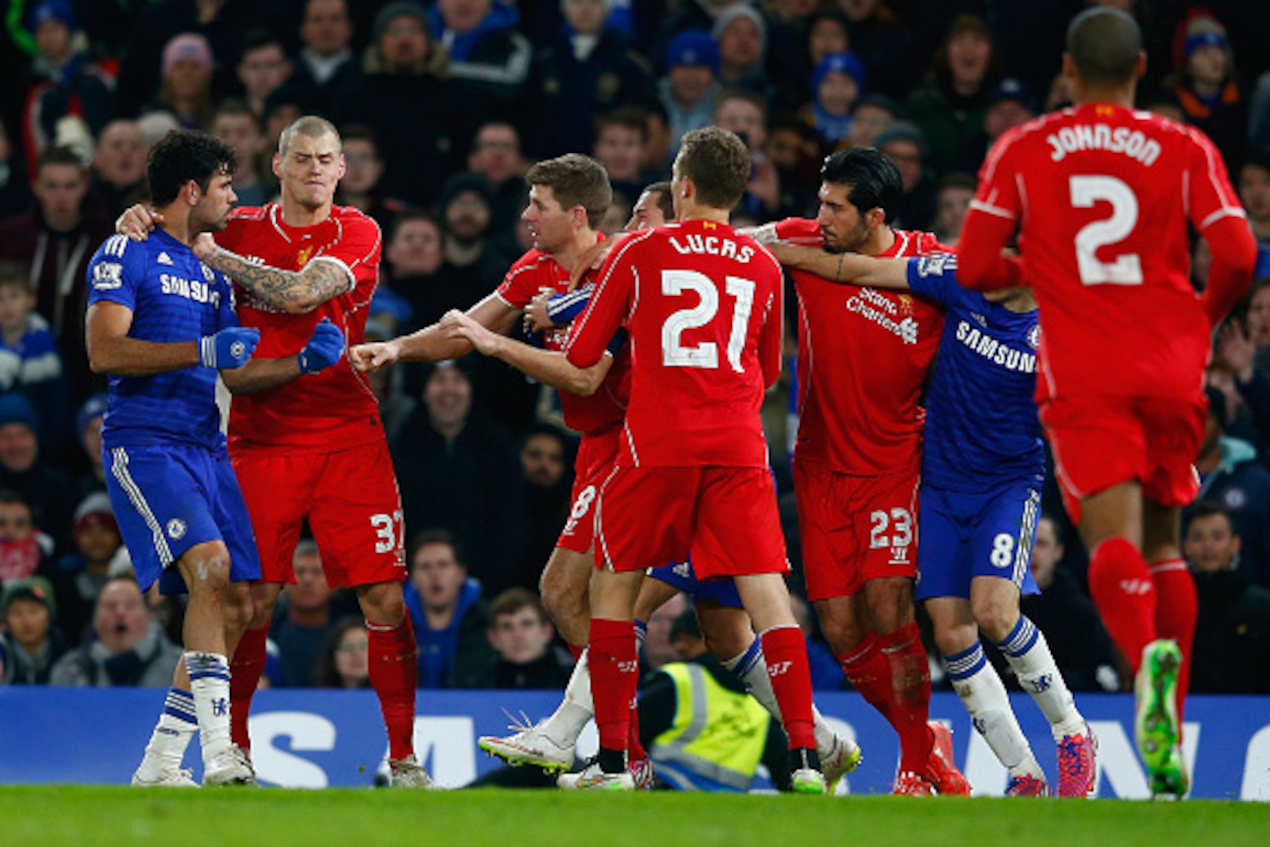 LONDON, ENGLAND - JANUARY 27:  Martin Skrtel of Liverpool (L) holds back Diego Costa of Chelsea as  he clashes with Steven Gerrard of Liverpool during the Capital One Cup Semi-Final second leg between Chelsea and Liverpool at Stamford Bridge on January 27