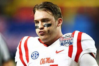 ATLANTA, GA - DECEMBER 31:  Bo Wallace #14 of the Ole Miss Rebels reacts in the fourth quarter against the TCU Horned Frogs during the Chik-fil-A Peach Bowl at Georgia Dome on December 31, 2014 in Atlanta, Georgia.  (Photo by Streeter Lecka/Getty Images)