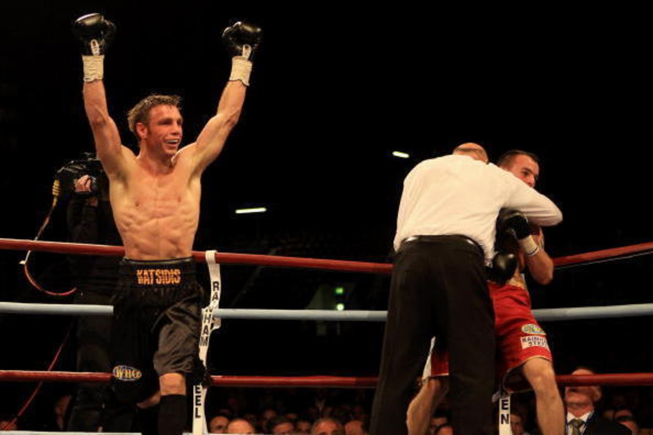 LONDON, ENGLAND - MAY 15:  Michael Katsidis of Australia celebrates beating Kevin Mitchell of England in the third round to retain the WBO Lightweight Championship of the World at Boleyn Ground on May 15, 2010 in London, England.  (Photo by Warren Little/