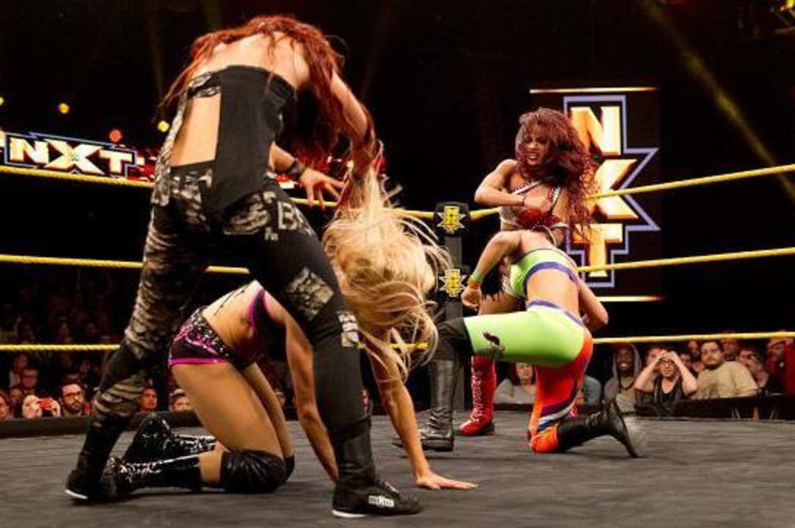 Becky Lynch attacks Charlotte; Bayley and Sasha Banks brawl.